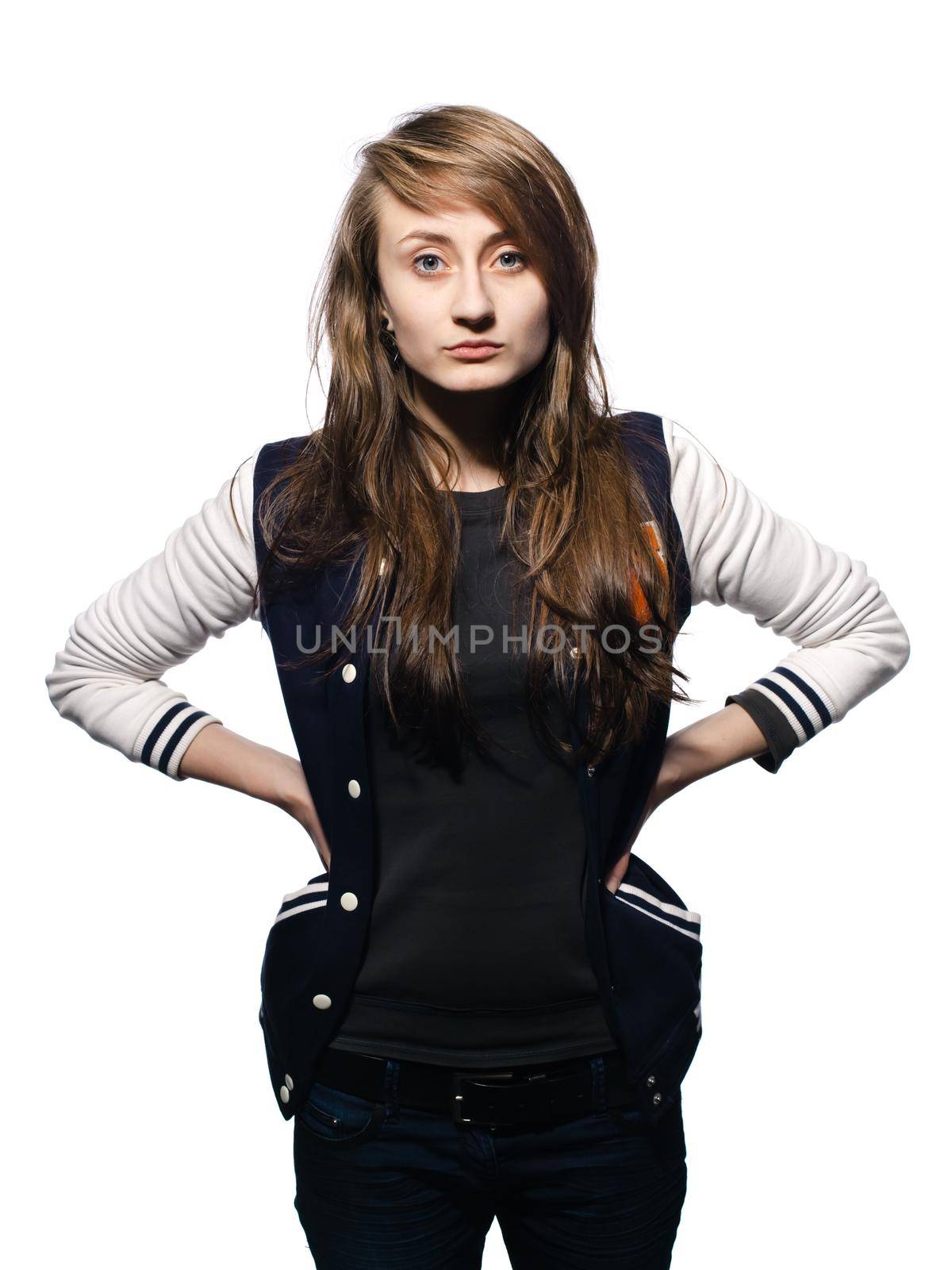 Happy teenage girl. Fashion, portrait and people concept. Portrait of a young emotional and stylish woman on a light background in the studio