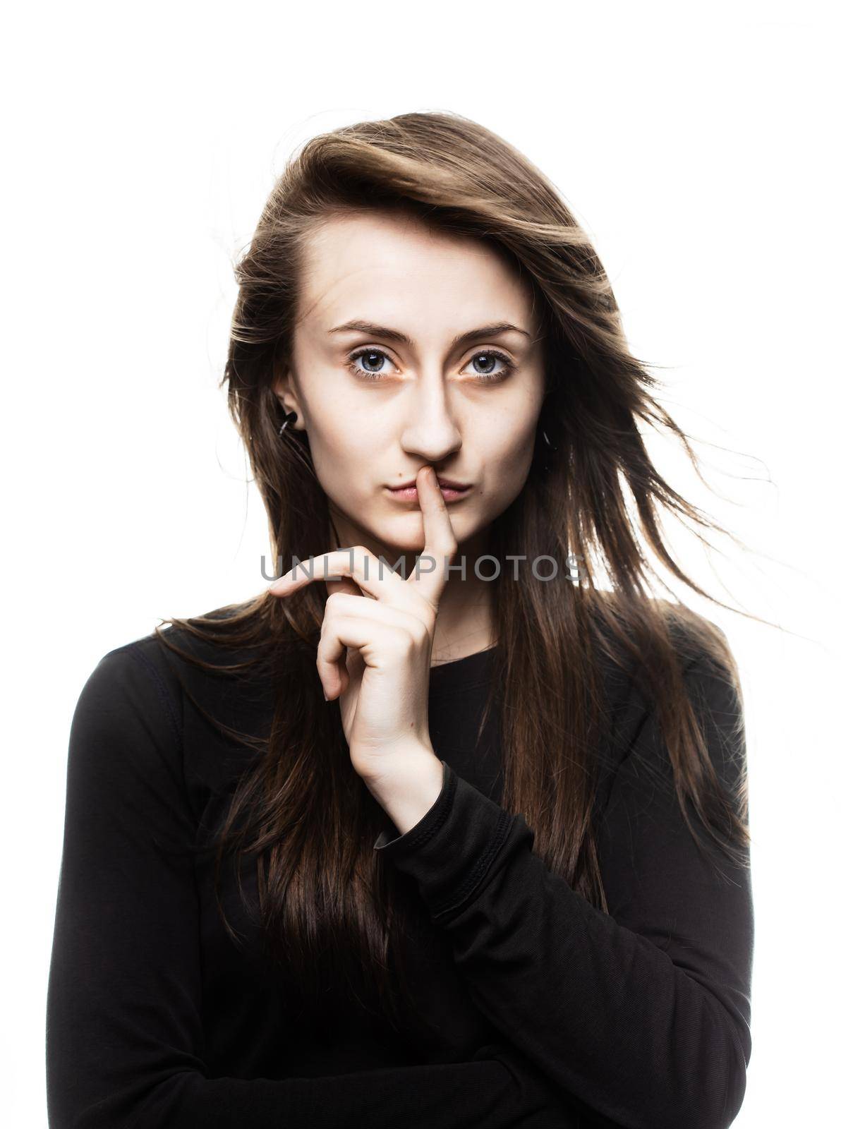 Happy teenage girl. Fashion, portrait and people concept. Portrait of a young emotional and stylish woman on a light background in the studio