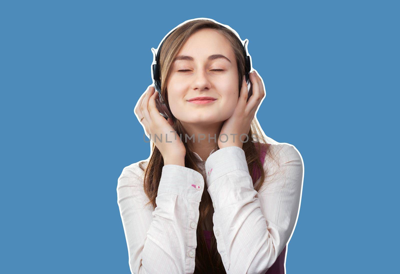 Girl listening to music in headphones by palinchak