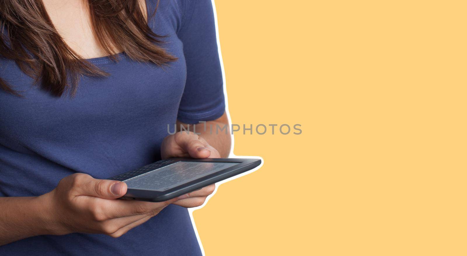 Young woman reading e-book  by palinchak