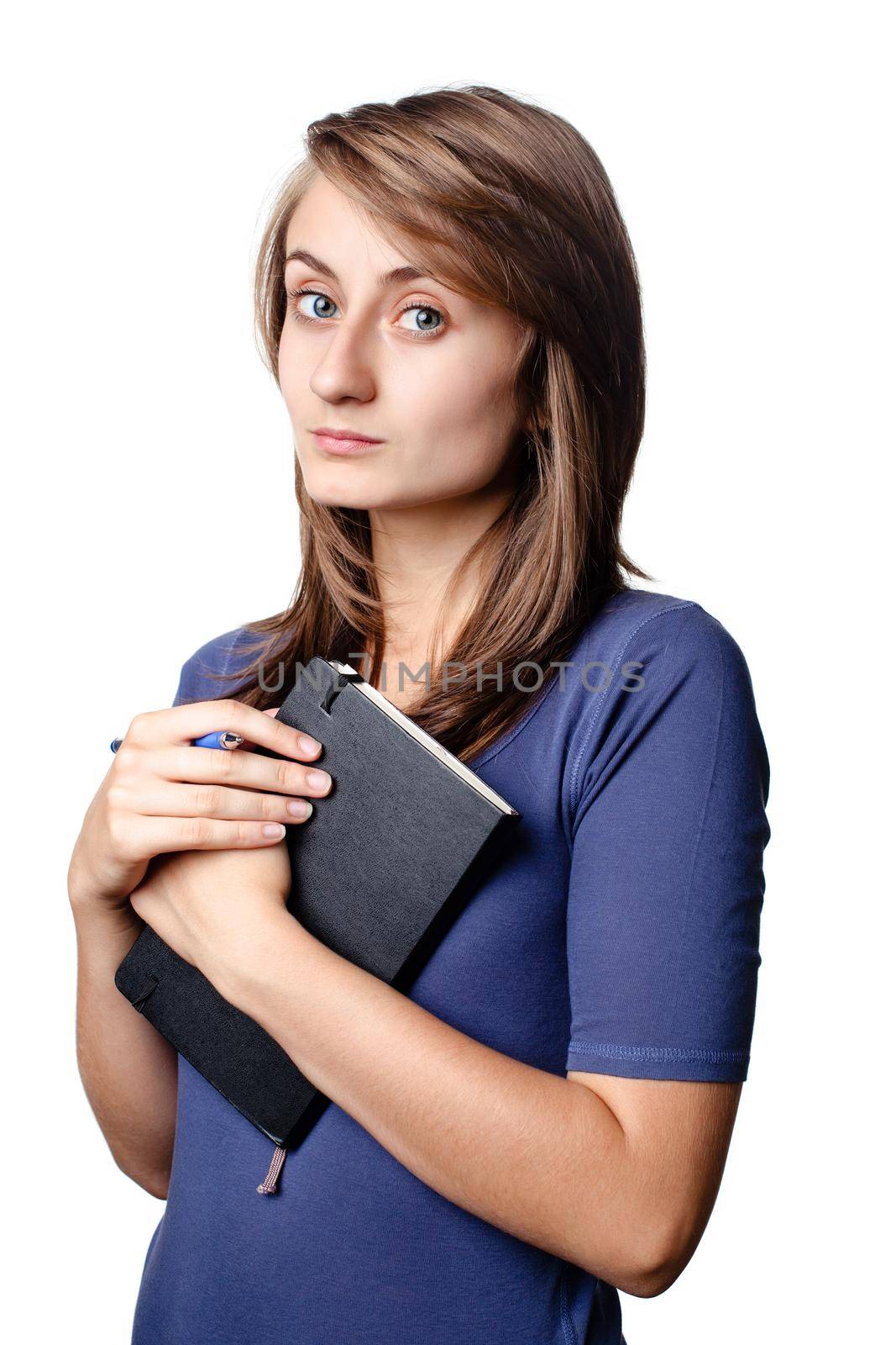 Young woman with a pen and notebook isolated on white