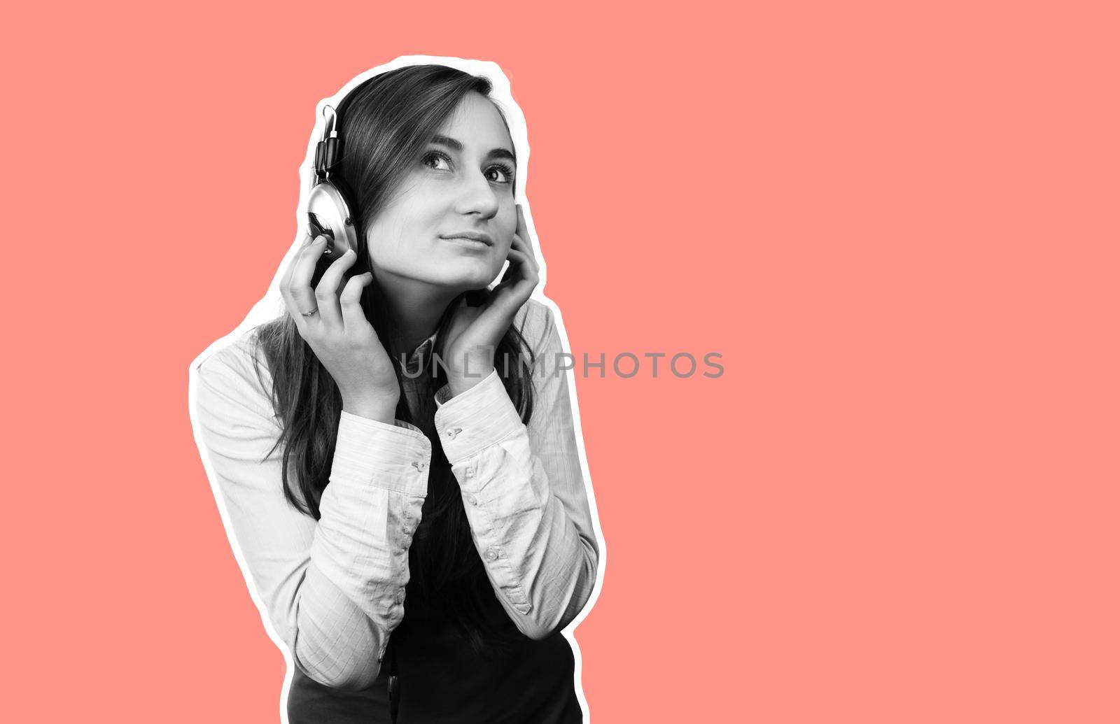 Beautiful young woman in headphones listening to music. Black and white image on trendy coral background. Magazine style collage