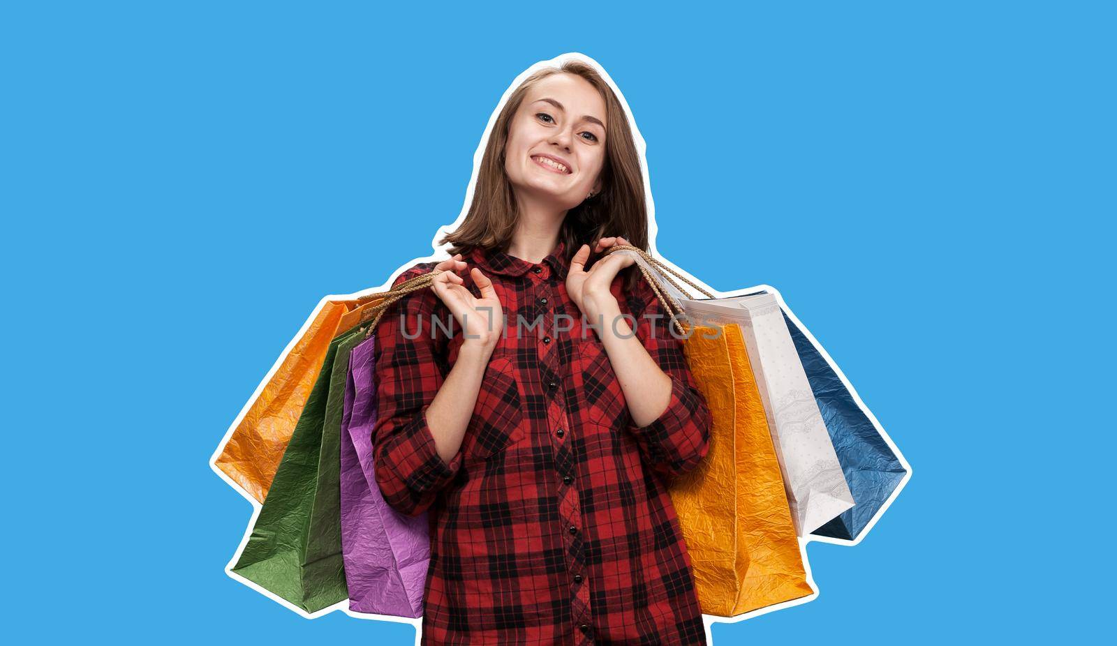 Happy young woman with shoping bags. Magazine style collage with copy space and blue background