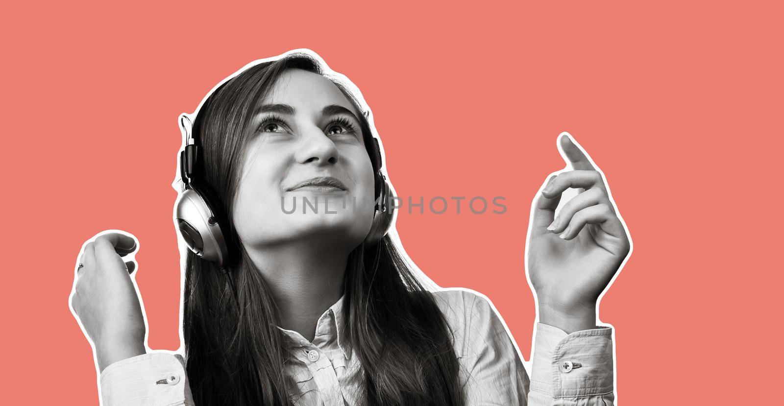 Lifestyle concept. Young happy woman listening to music on headphones. Magazine style collage with copy space and trendy coral color background