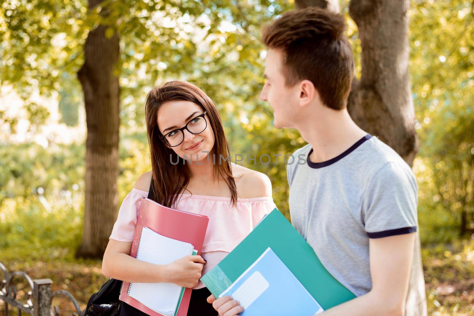 Female student looks at her male friend with interest and love