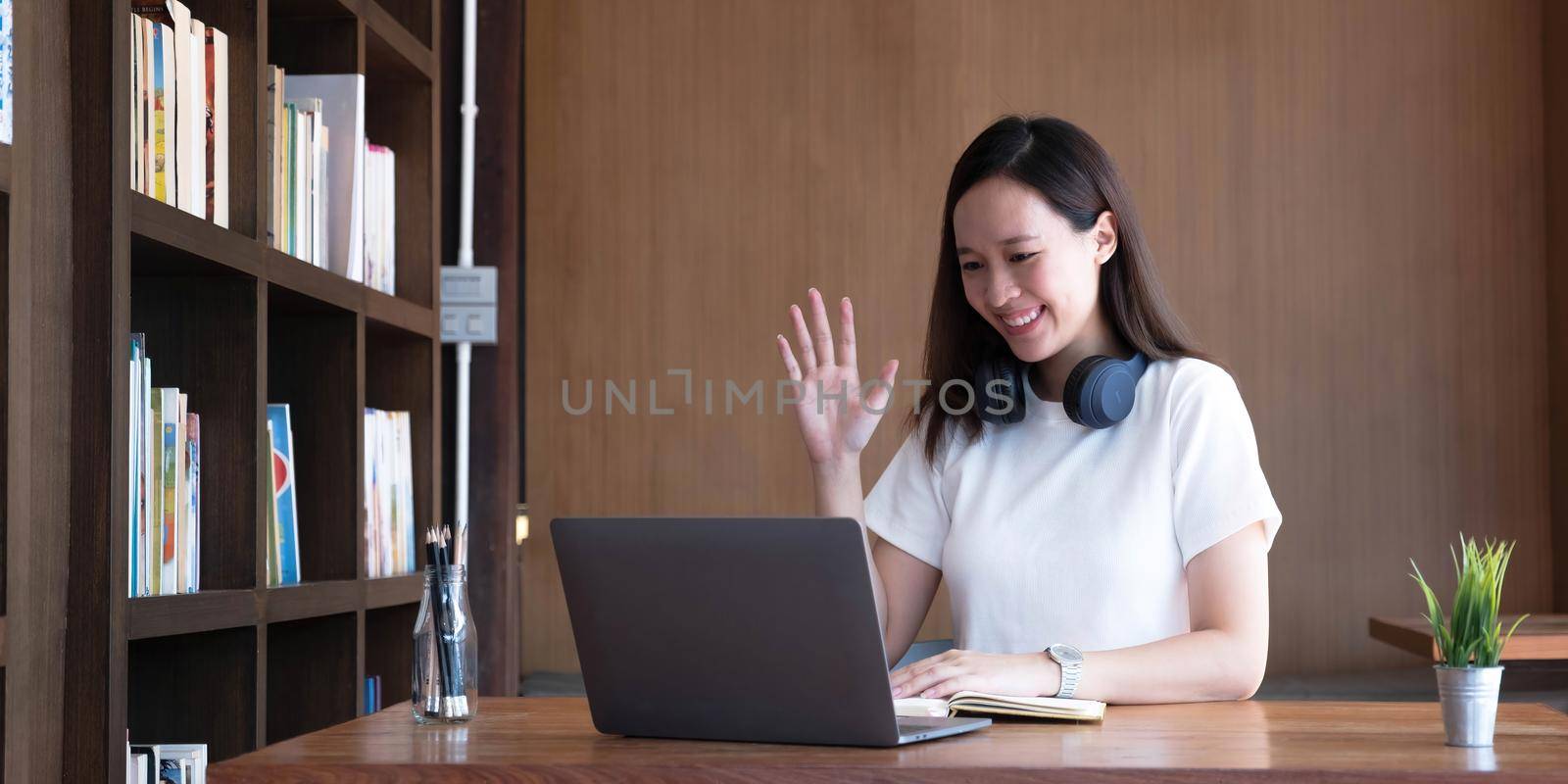 Asian girl student online learning class study online video call zoom teacher, Happy asian girl learn english language online with computer laptop. by wichayada