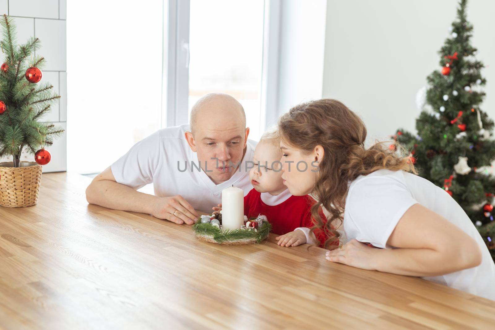 Child girl dressed in christmas dress with cochlear implants having fun at home - diversity and hearing aid and innovating technologies for treatment of deafness. by Satura86