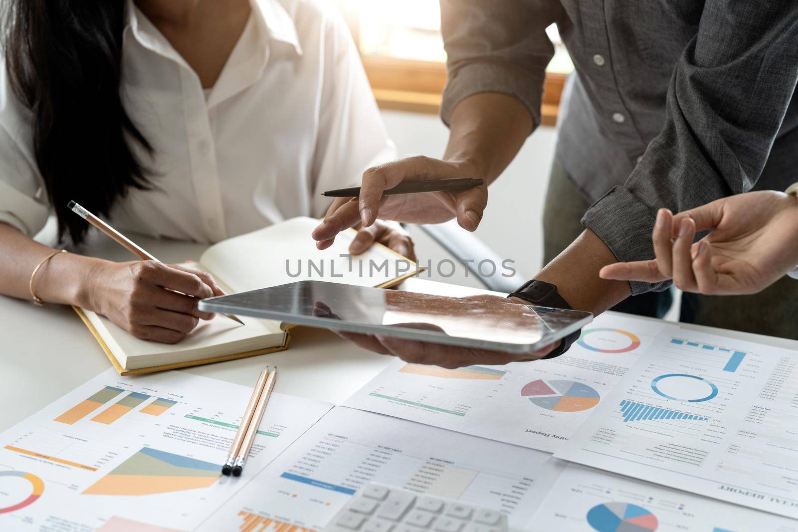 Business People Meeting to analyse and discuss and brainstorming the financial report chart data in office Financial advisor teamwork and accounting concept