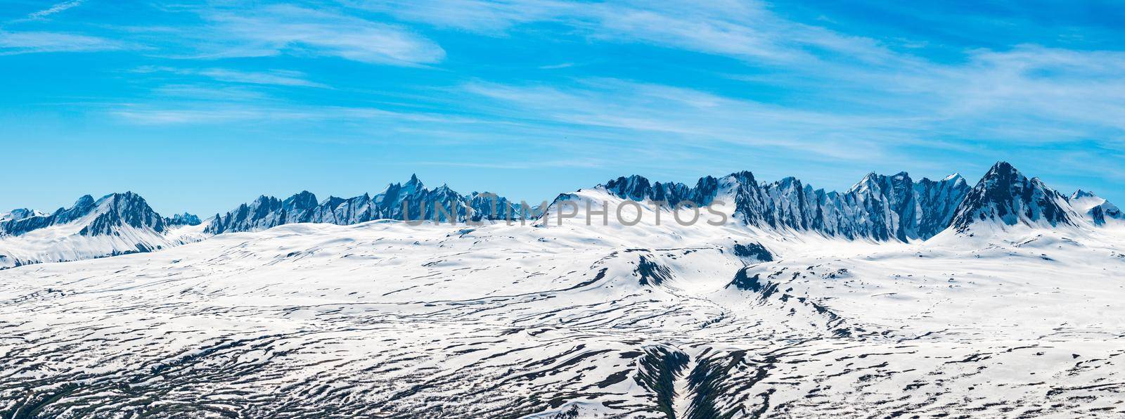 Broad high definition view of majestic and jagged mountains of Thompson Pass near Valdez in Alaska