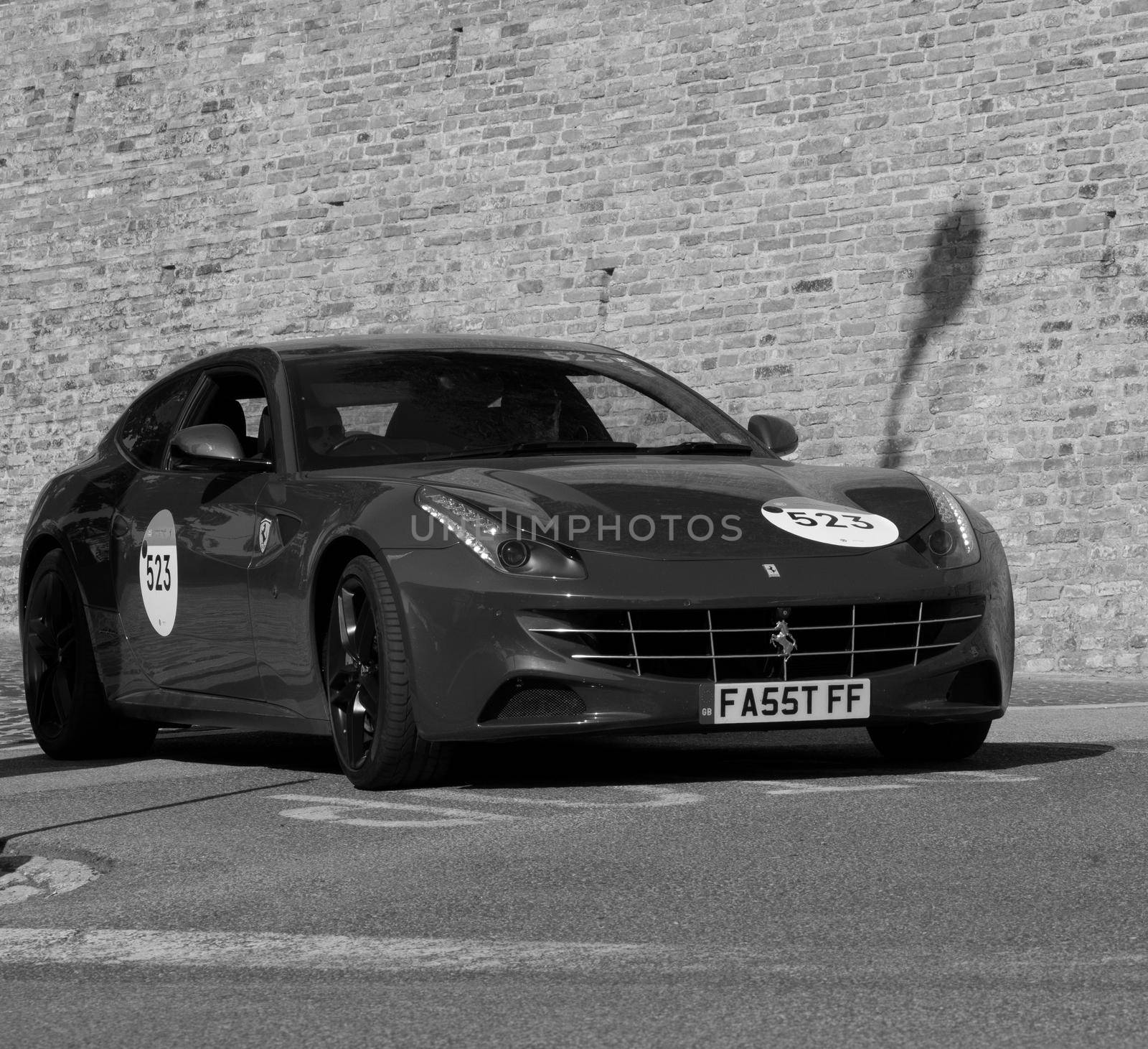 URBINO, ITALY - JUN 16 - 2022 : FERRARI TRIBUTE Ferrari Ff IN an old racing car in rally Mille Miglia 2022