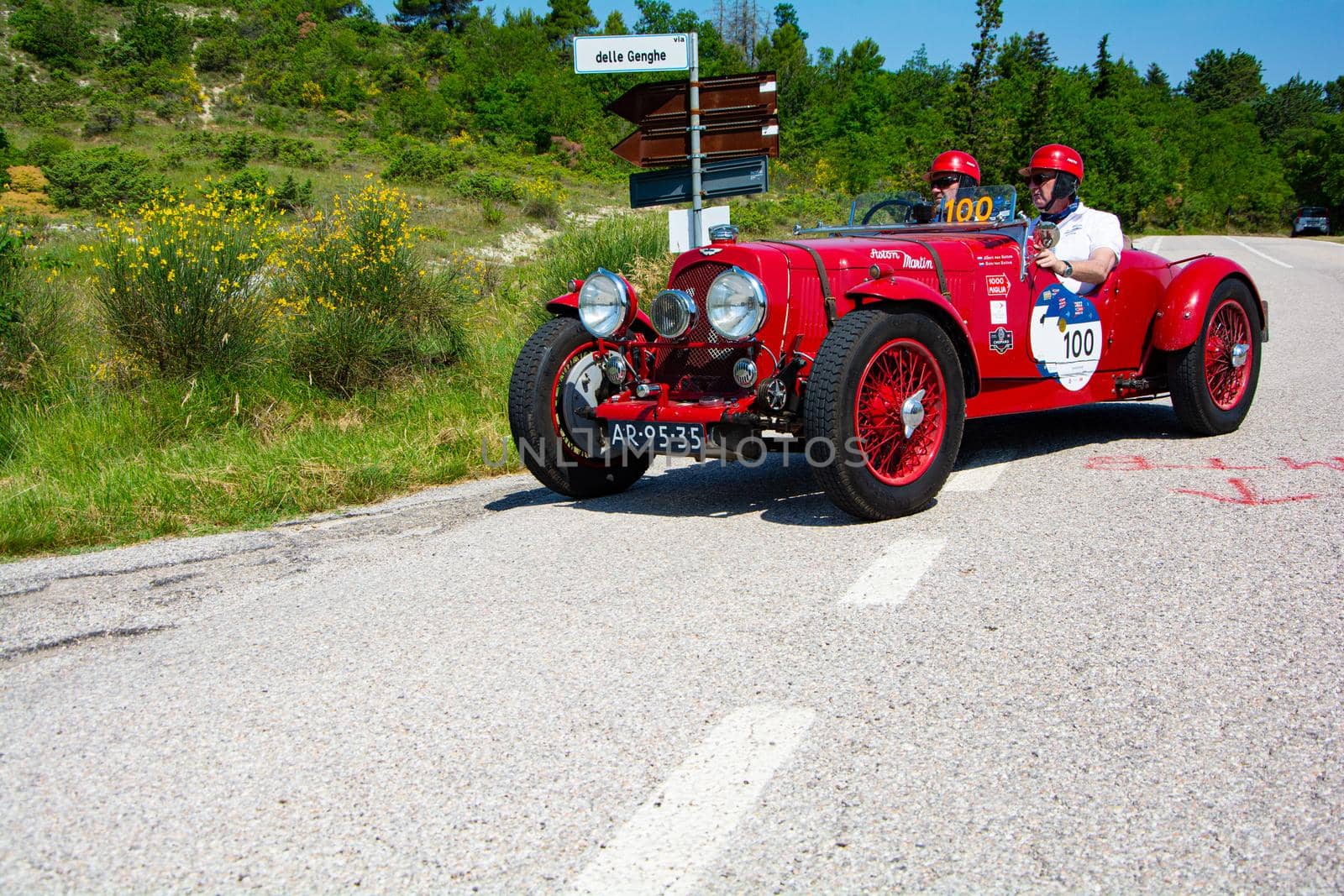 URBINO, ITALY - JUN 16 - 2022 : ASTON MARTIN 2 LITRE SPEED MODEL 1937 on an old racing car in rally Mille Miglia 2022 the famous italian historical race (1927-1957