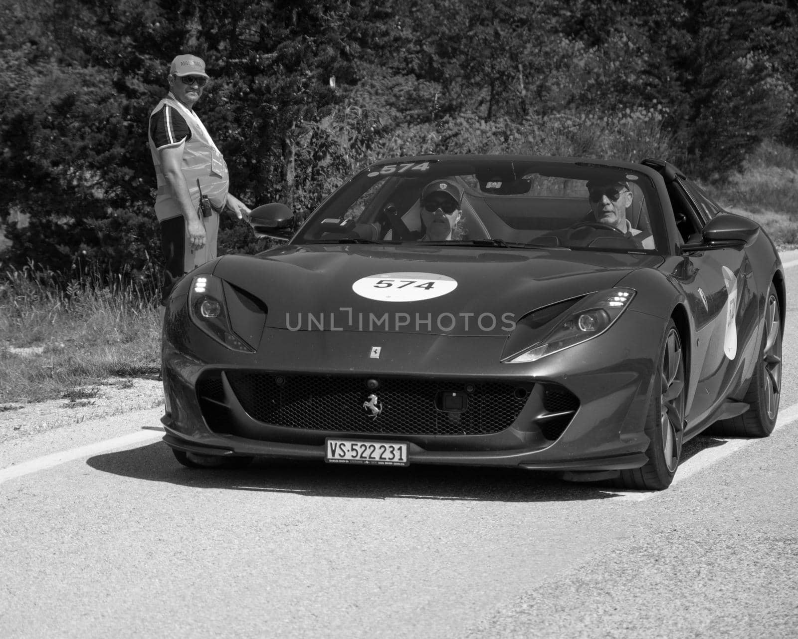 URBINO, ITALY - JUN 16 - 2022 : FERRARI TRIBUTE Ferrari 812 Gts IN an old racing car in rally Mille Miglia 2022