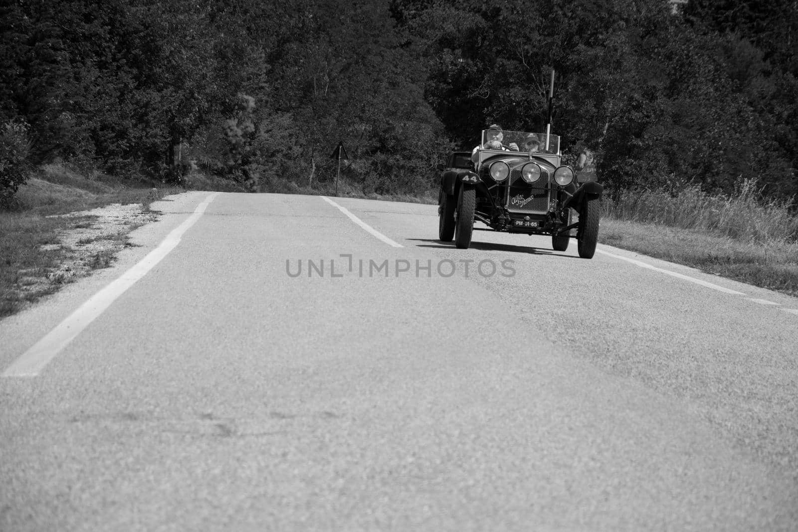 URBINO, ITALY - JUN 16 - 2022 : ALFA ROMEO 6C 1750 SUPER SPORT ZAGATO 1929 on an old racing car in rally Mille Miglia 2022 the famous italian historical race (1927-1957