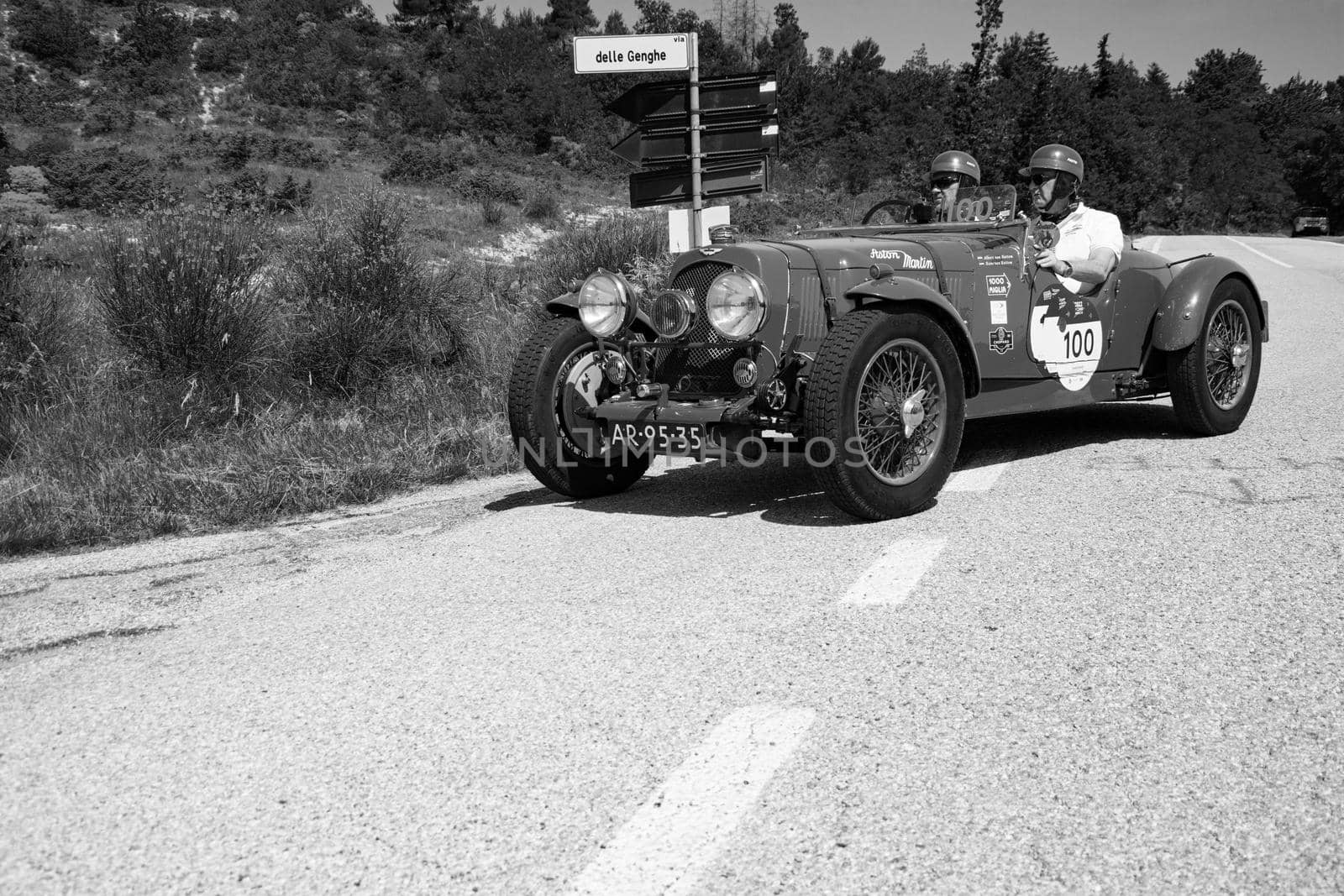 URBINO, ITALY - JUN 16 - 2022 : ASTON MARTIN 2 LITRE SPEED MODEL 1937 on an old racing car in rally Mille Miglia 2022 the famous italian historical race (1927-1957 by massimocampanari