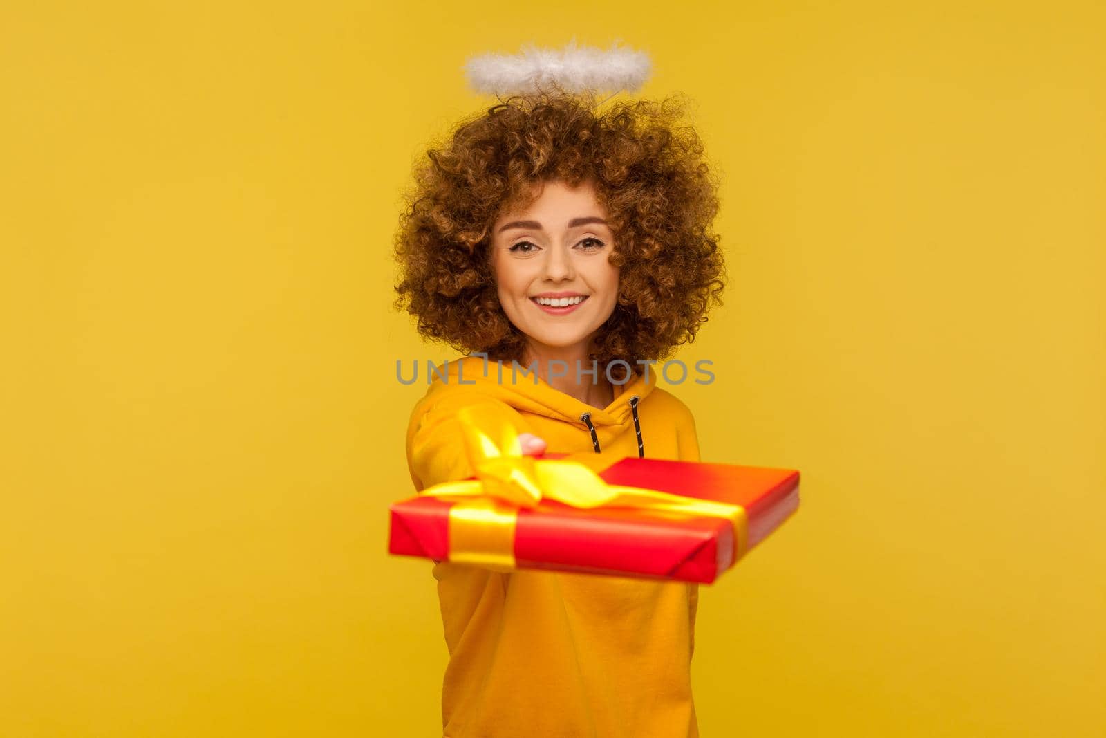 Portrait of emotional curly girl on yellow background. by Khosro1