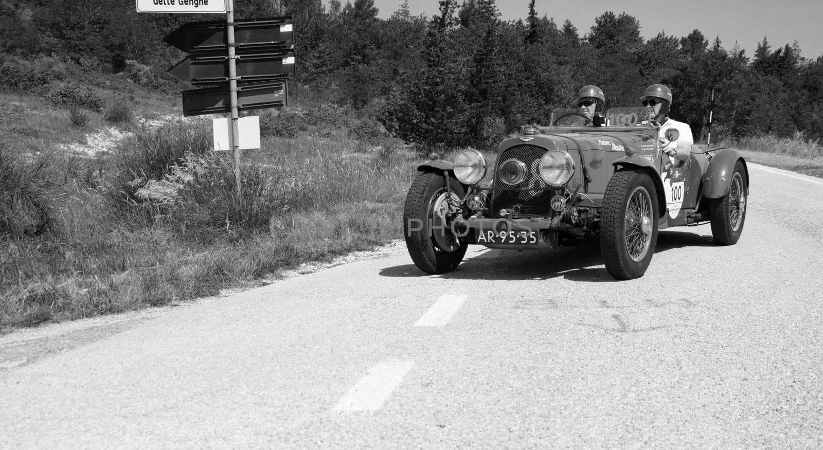 URBINO, ITALY - JUN 16 - 2022 : ASTON MARTIN 2 LITRE SPEED MODEL 1937 on an old racing car in rally Mille Miglia 2022 the famous italian historical race (1927-1957