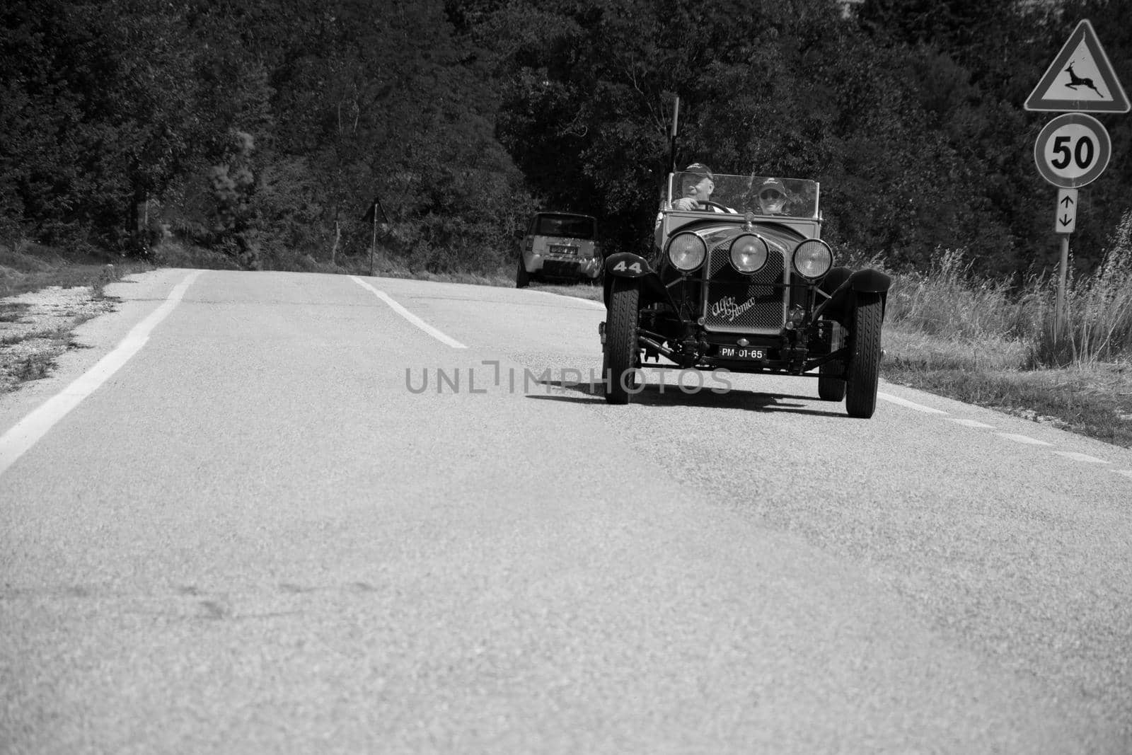 URBINO, ITALY - JUN 16 - 2022 : ALFA ROMEO 6C 1750 SUPER SPORT ZAGATO 1929 on an old racing car in rally Mille Miglia 2022 the famous italian historical race (1927-1957
