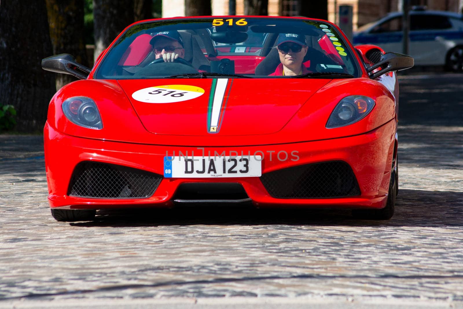 URBINO, ITALY - JUN 16 - 2022 : FERRARI TRIBUTE Ferrari Scuderia Spider 16M IN an old racing car in rally Mille Miglia 2022