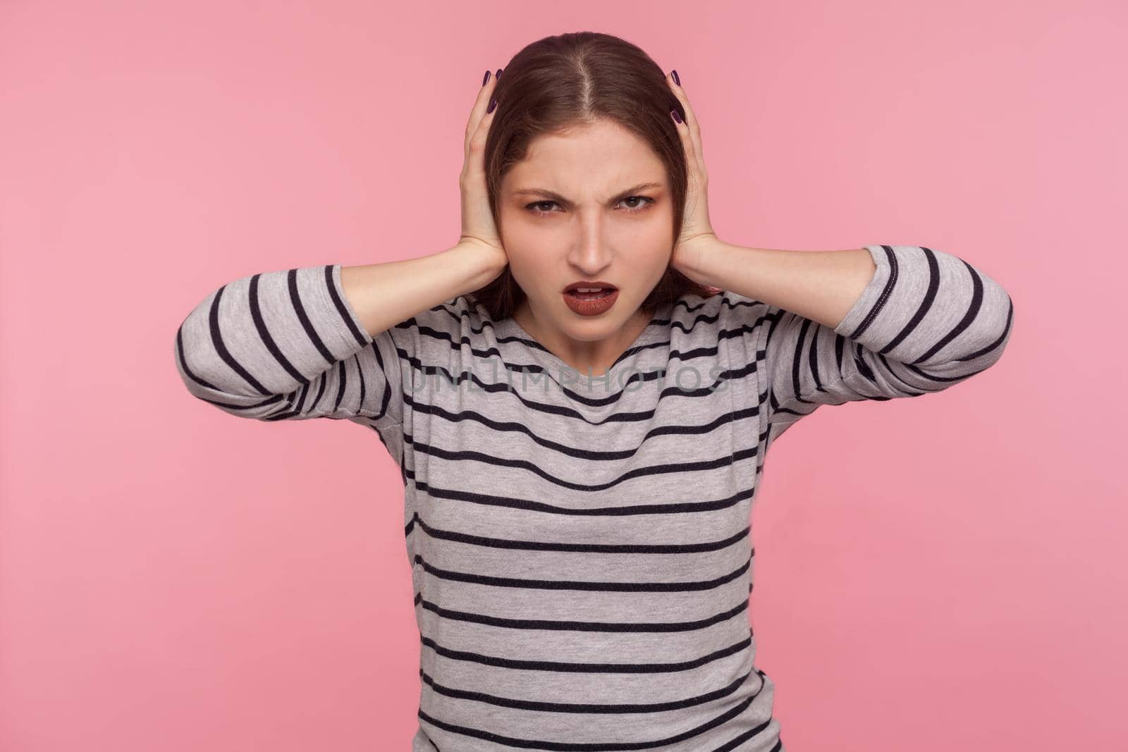 Portrait of emotional brunette young woman on pink background. by Khosro1