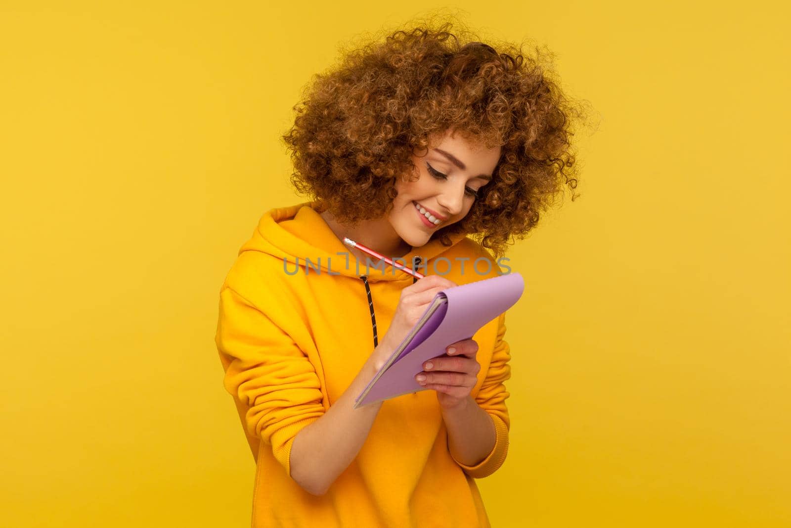 Portrait of emotional curly girl on yellow background. by Khosro1