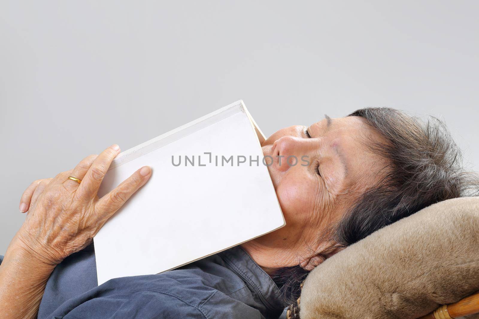 elderly woman fell asleep with book