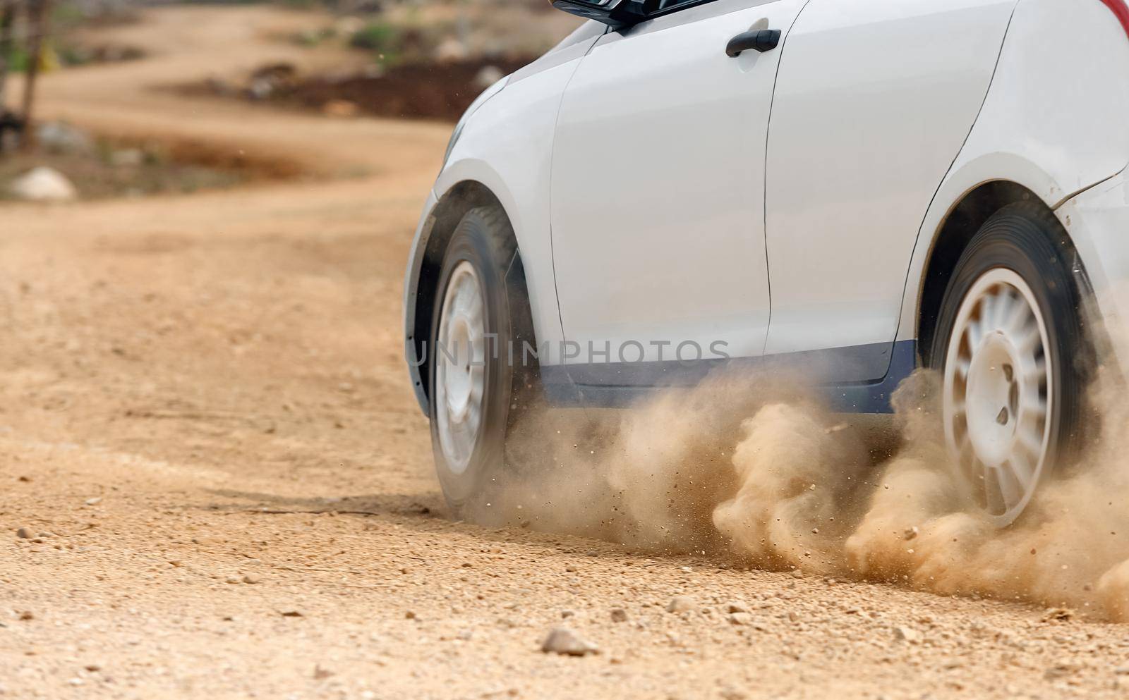 Rally car in dirt track.
