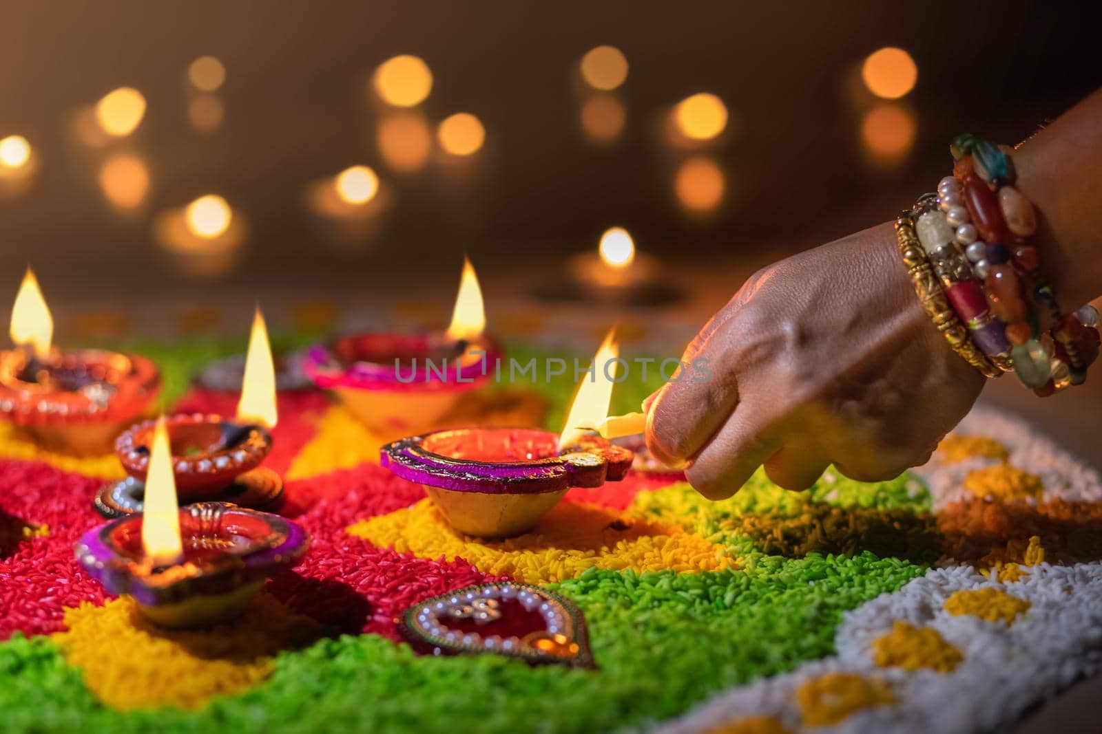 Traditional diya lamps lit during diwali celebration by toa55