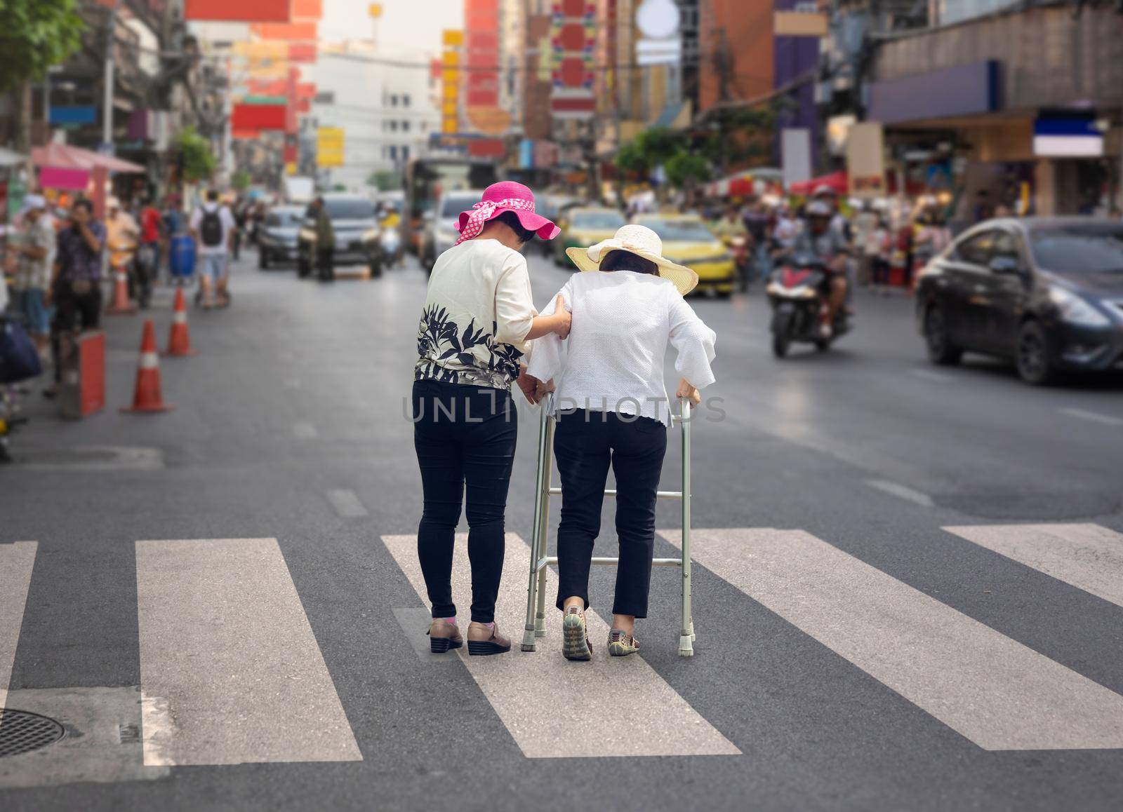Daughter take care elderly woman crossing the street in Chinatown area by toa55