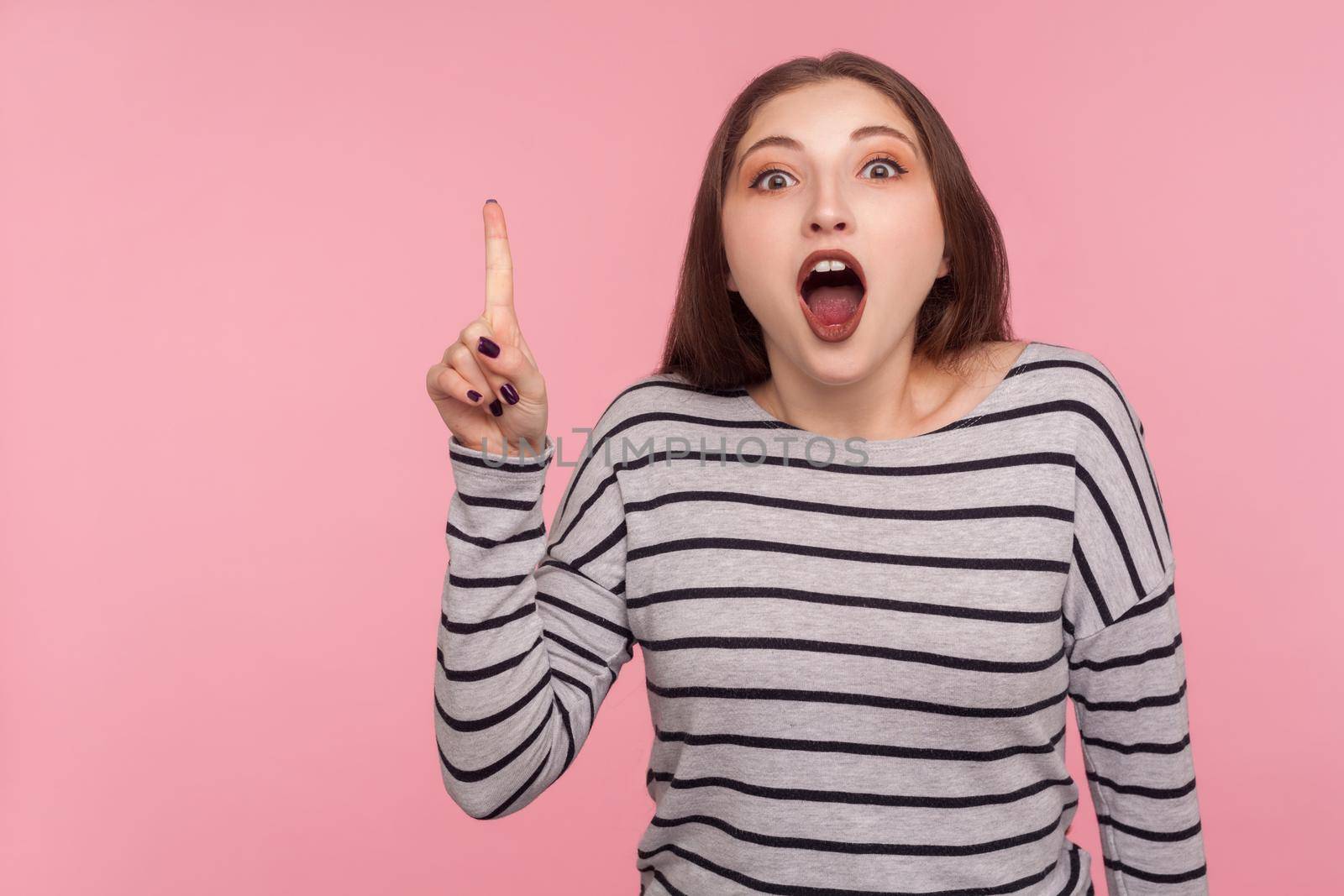 Portrait of emotional brunette young woman on pink background. by Khosro1