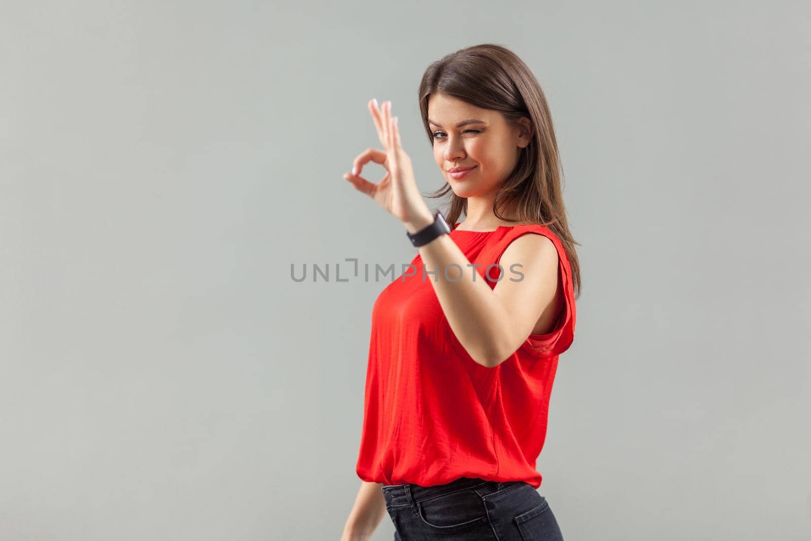 Emotional brunette woman on gray background. by Khosro1