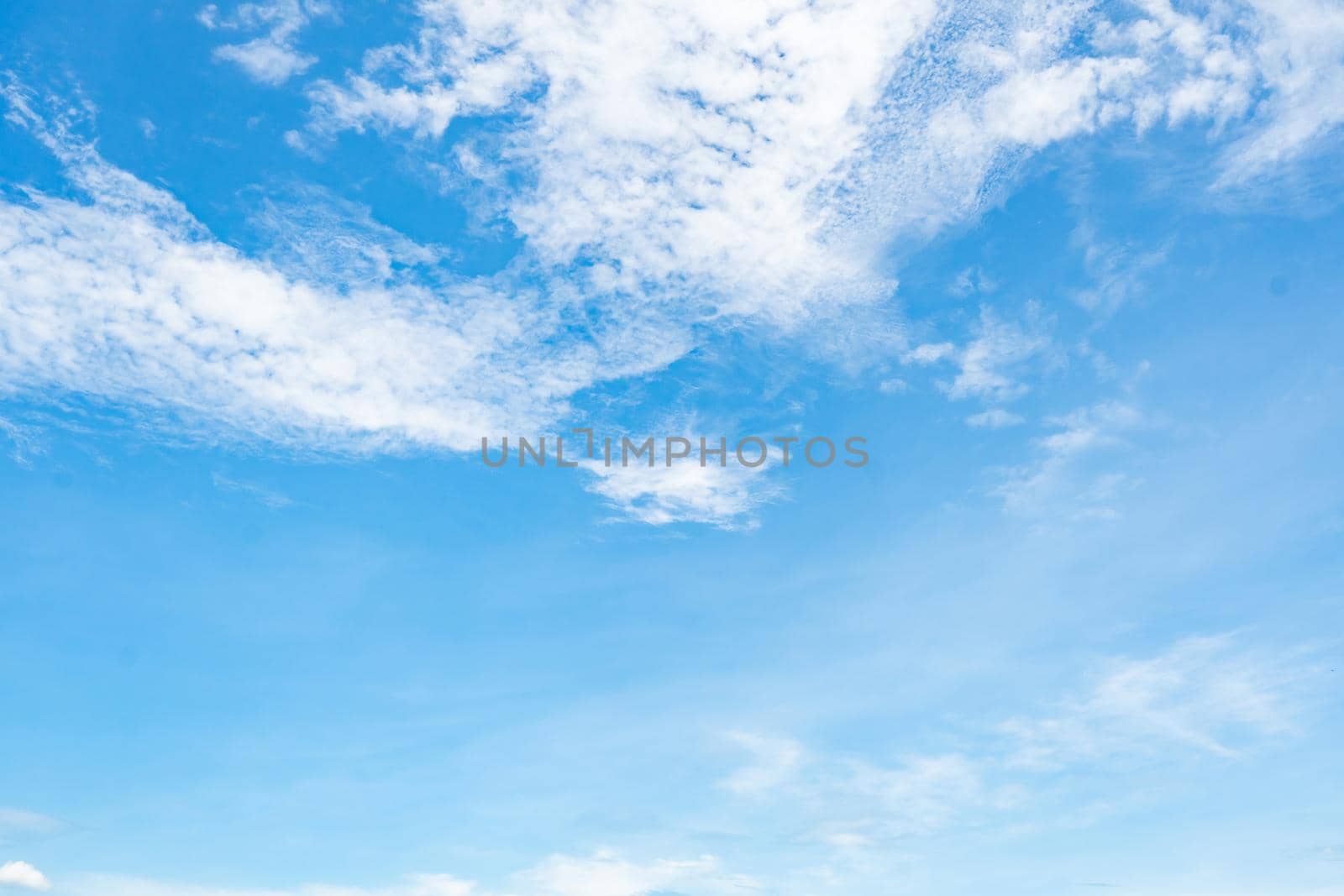 Beautiful blue sky and white clouds abstract background. Cloudscape background. Blue sky and fluffy white clouds on sunny day. Nature weather. Beautiful blue sky for happy day background. Summer sky.