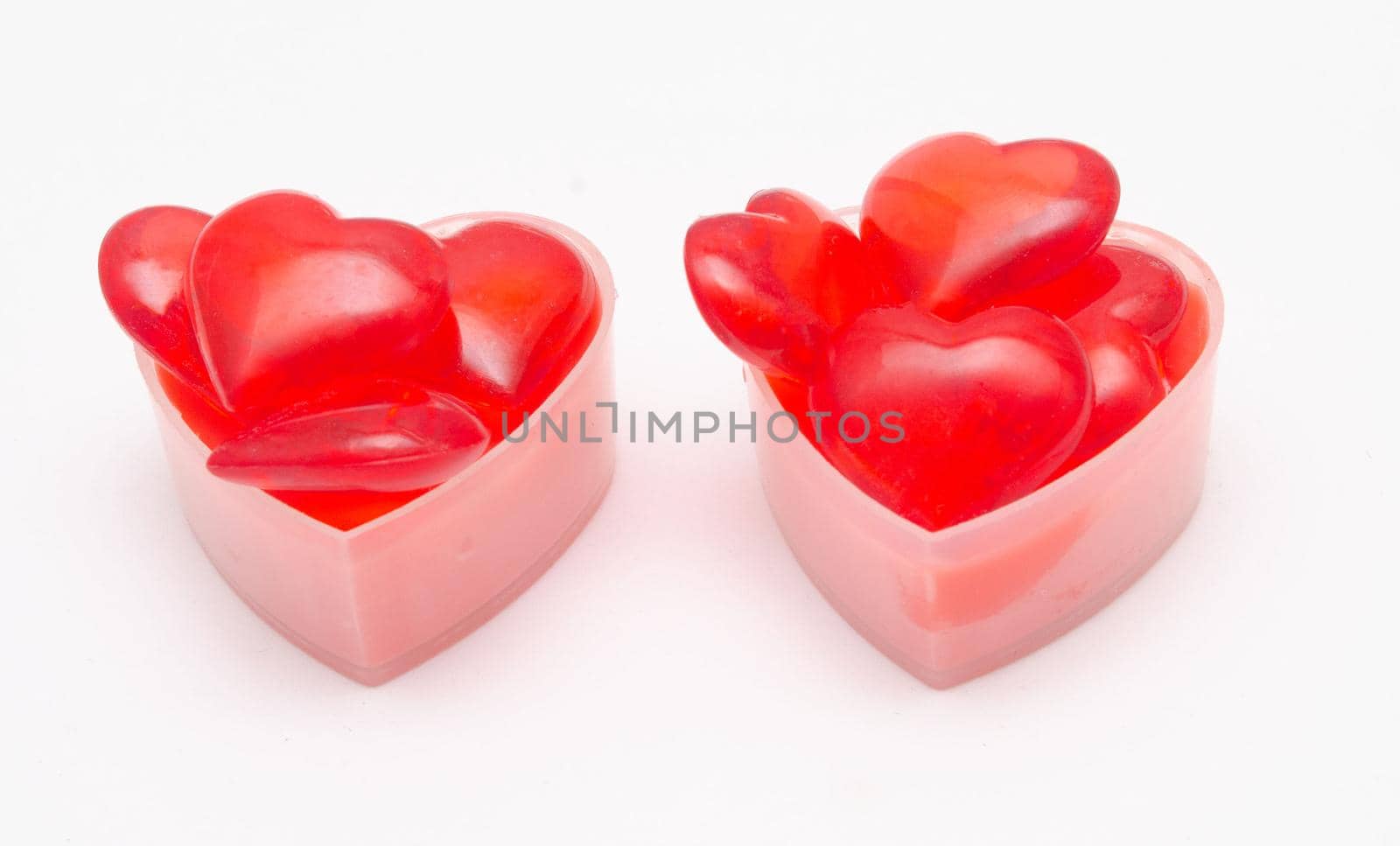 several red valentine hearts in two heart shape together isolated on white background. by andre_dechapelle