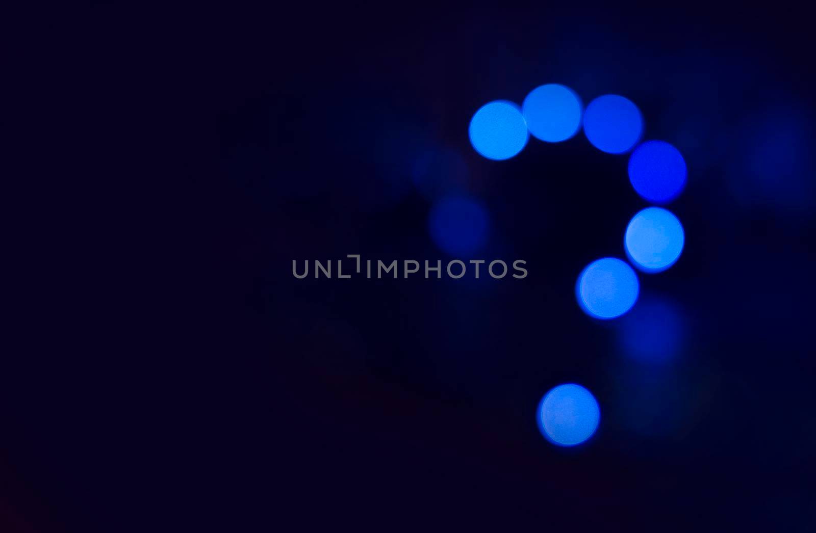 Question mark in blue abstract light background. Neon light night discussion.