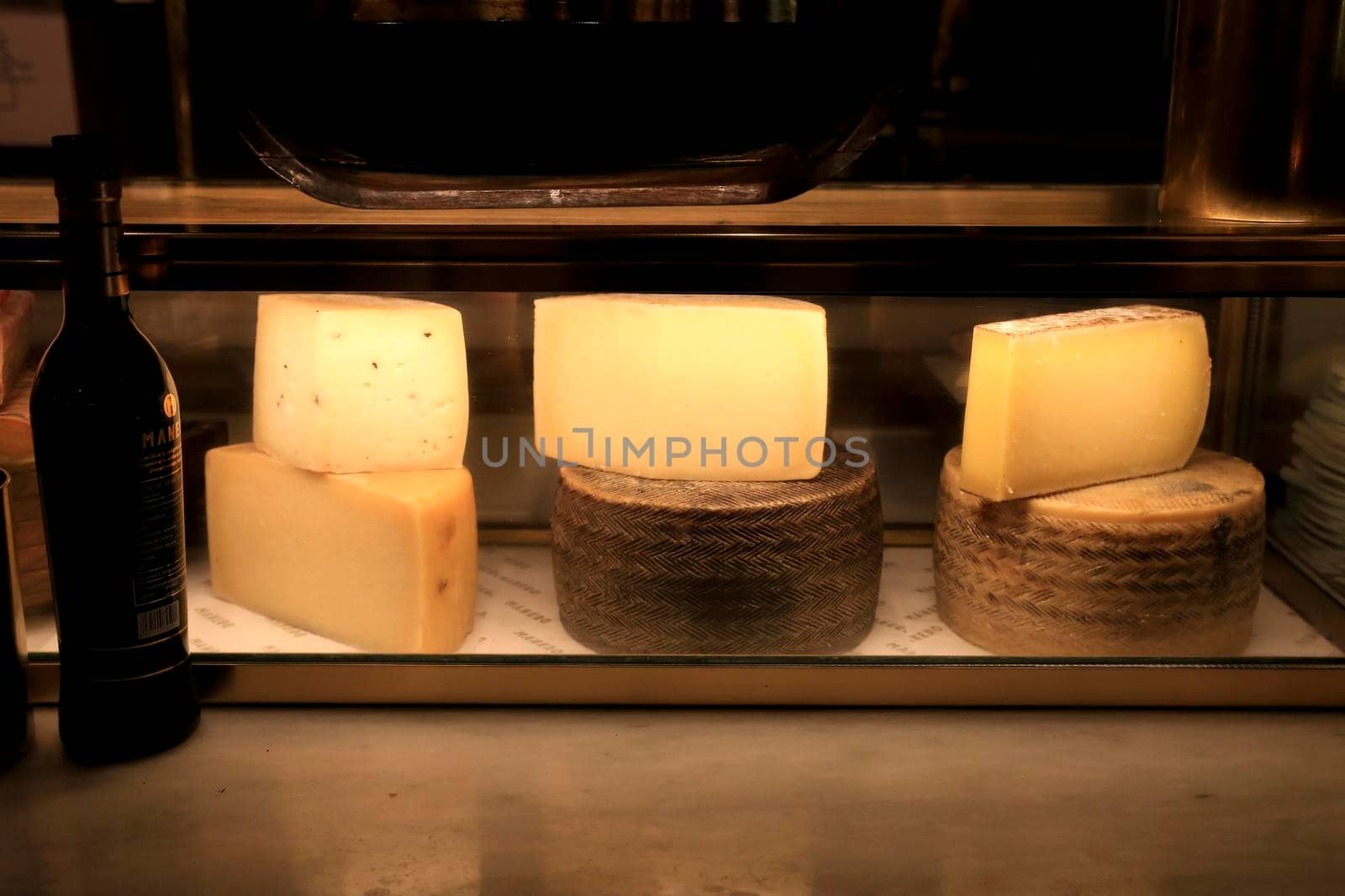 Alicante, Spain- June 26, 2022: Tasty cured Spanish cheeses at a restaurant called Manero in Alicante