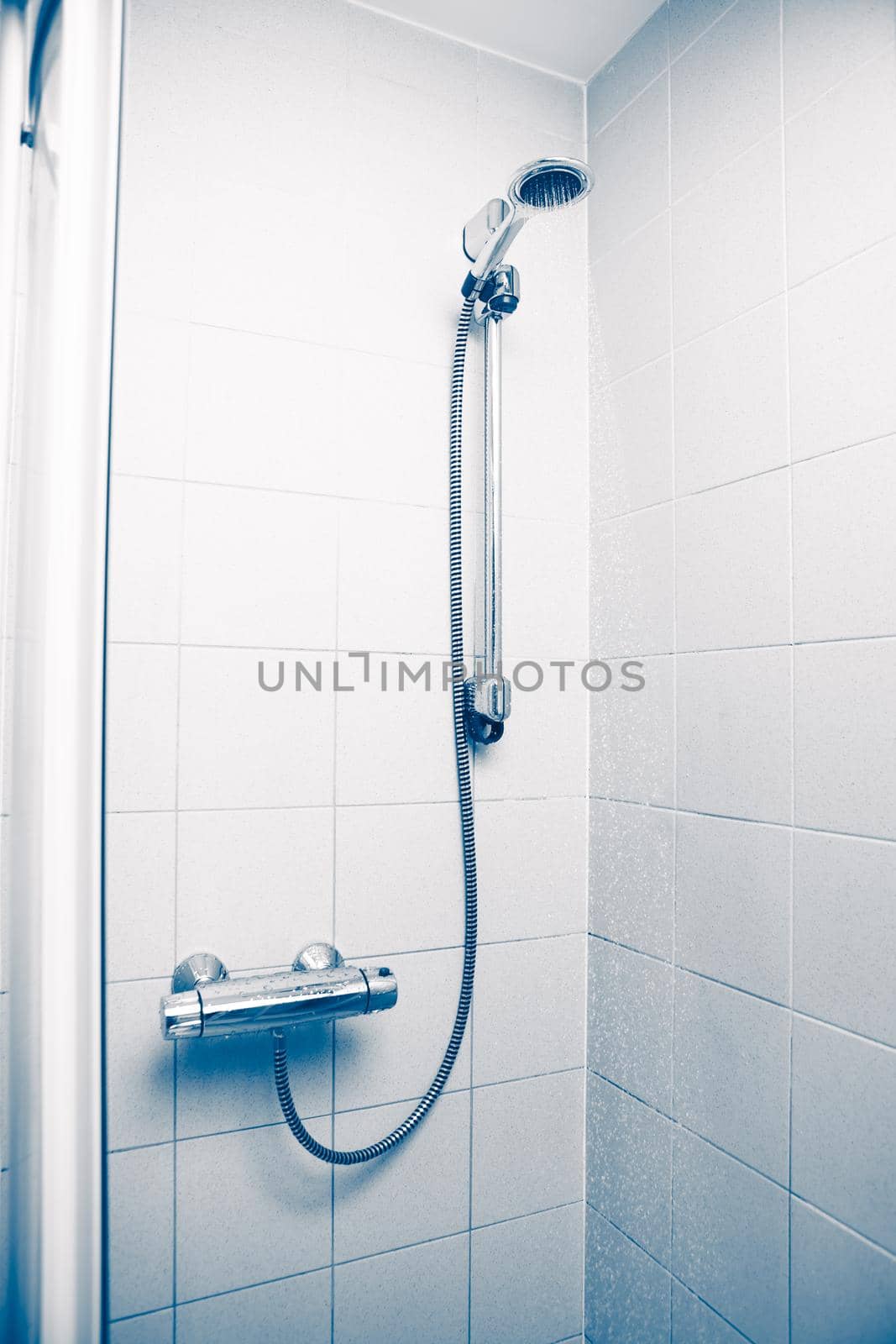 shower with water stream, blue background