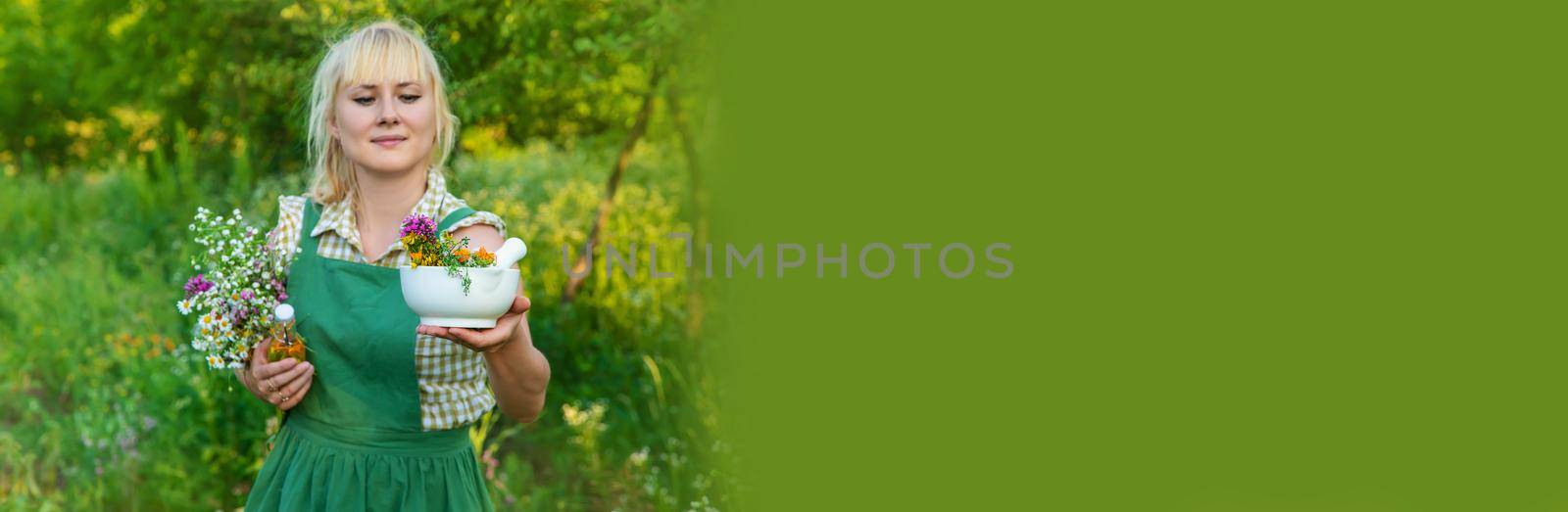 A woman makes herbal tincture. Selective focus. Nature.