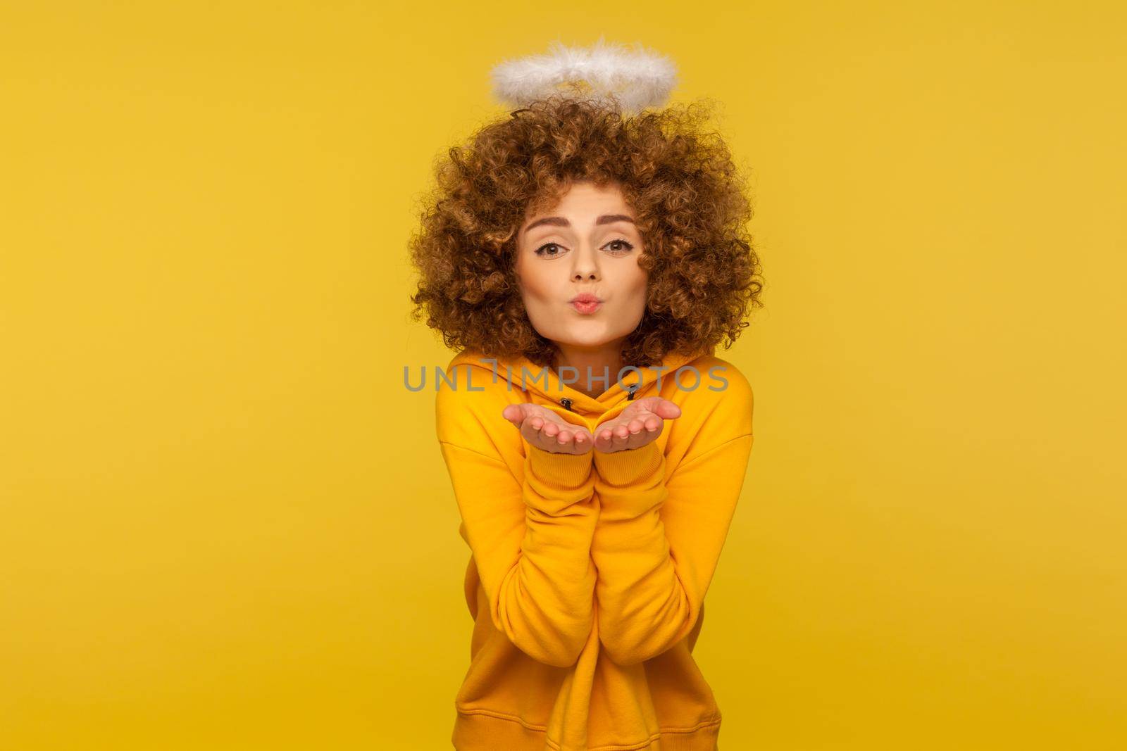 Portrait of emotional curly girl on yellow background. by Khosro1