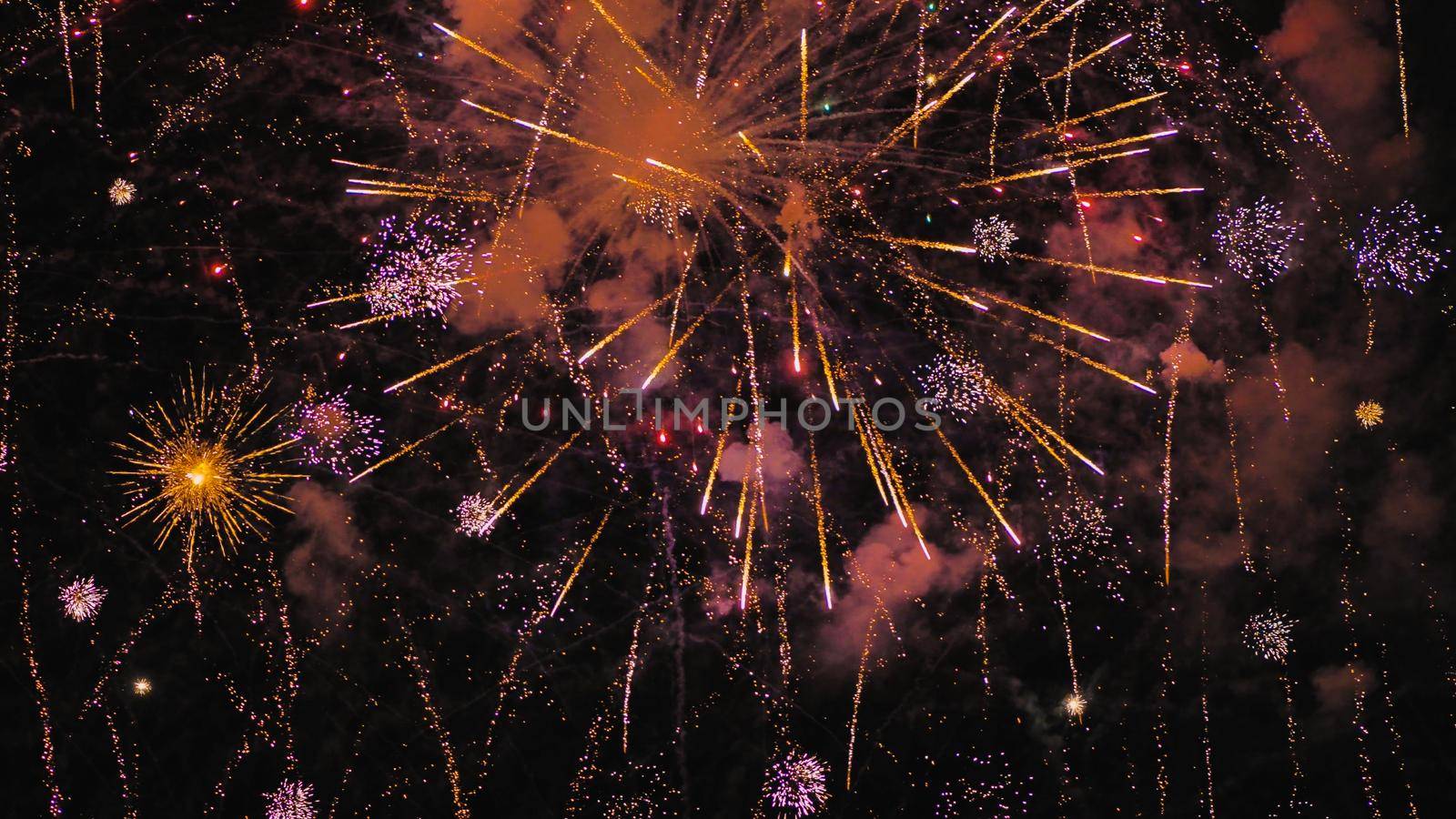 A colourful explosion of fireworks in the night sky. by DovidPro