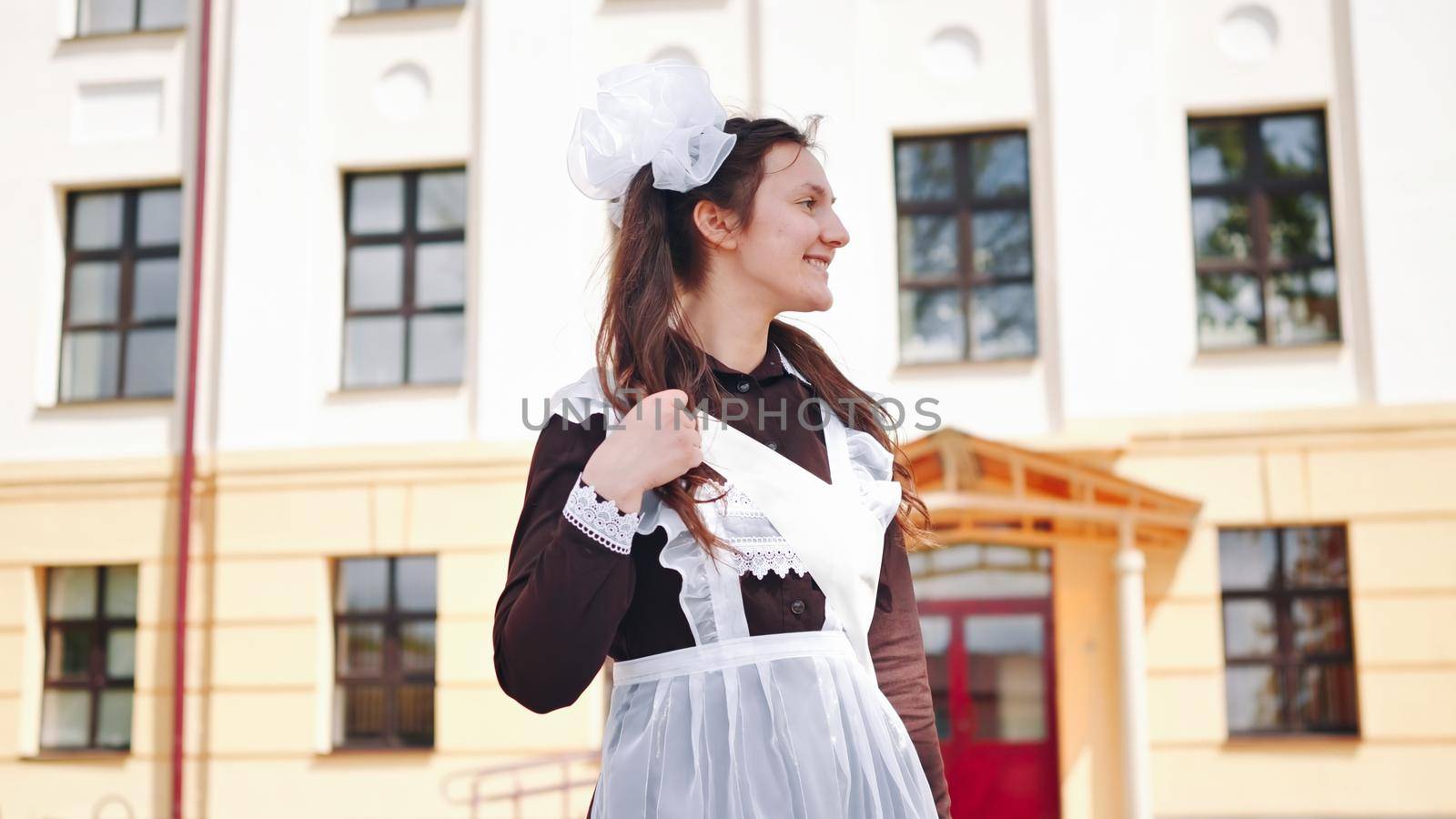 Happy Russian schoolgirl on the last day of school