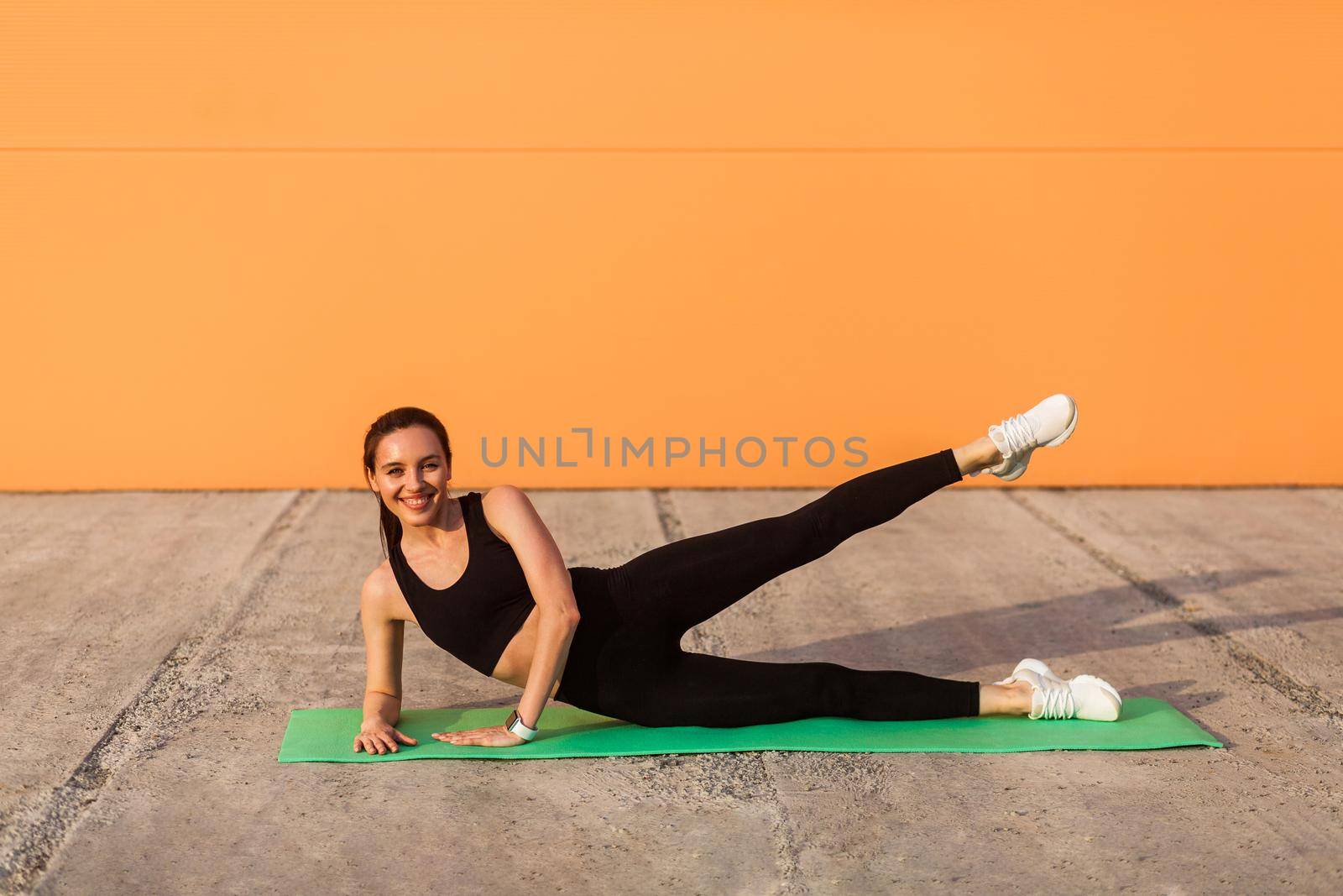 Young brunette woman and sport workout outdoor. by Khosro1