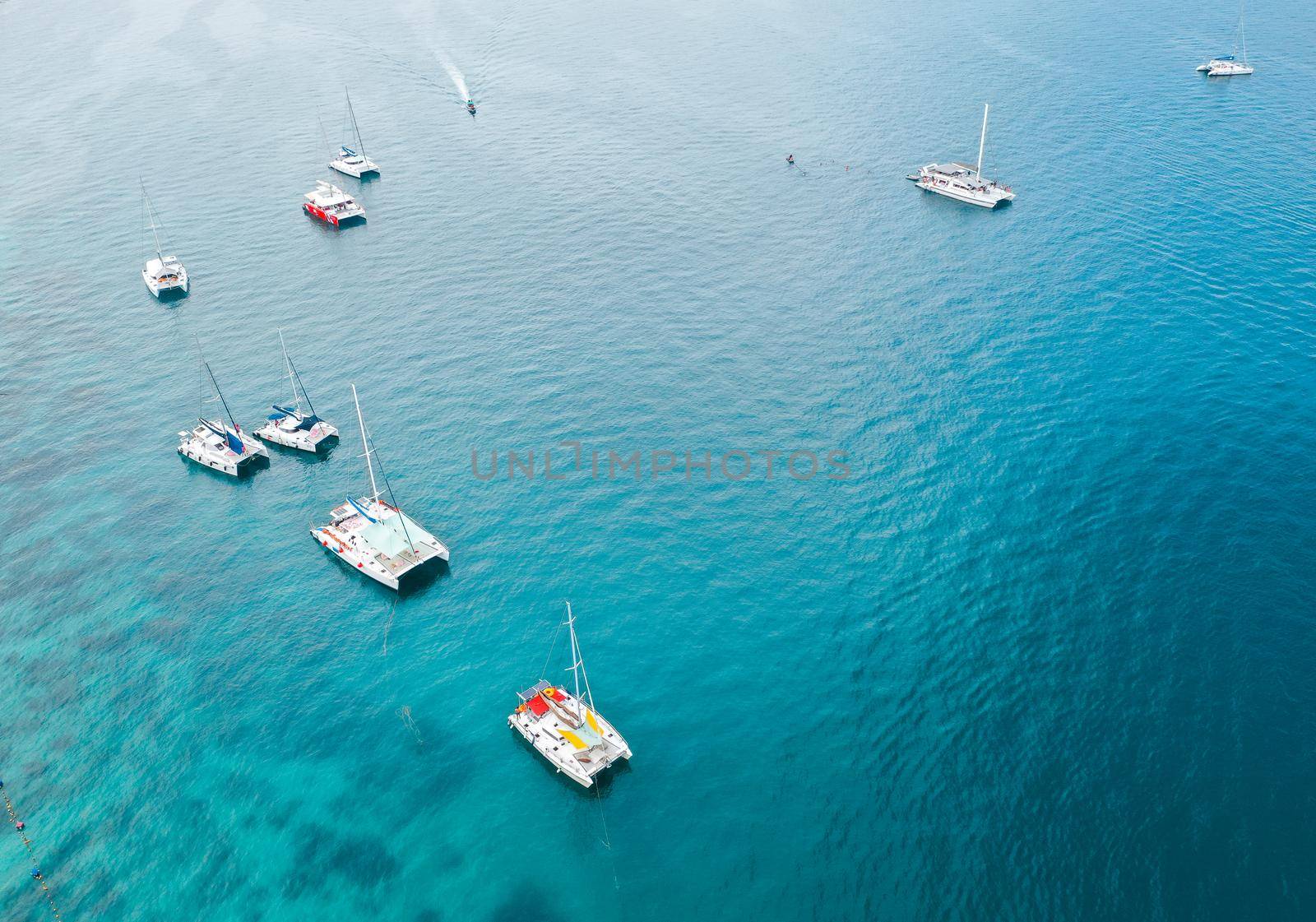 Coral island, koh He, beach and boats in Phuket province, Thailand by worldpitou