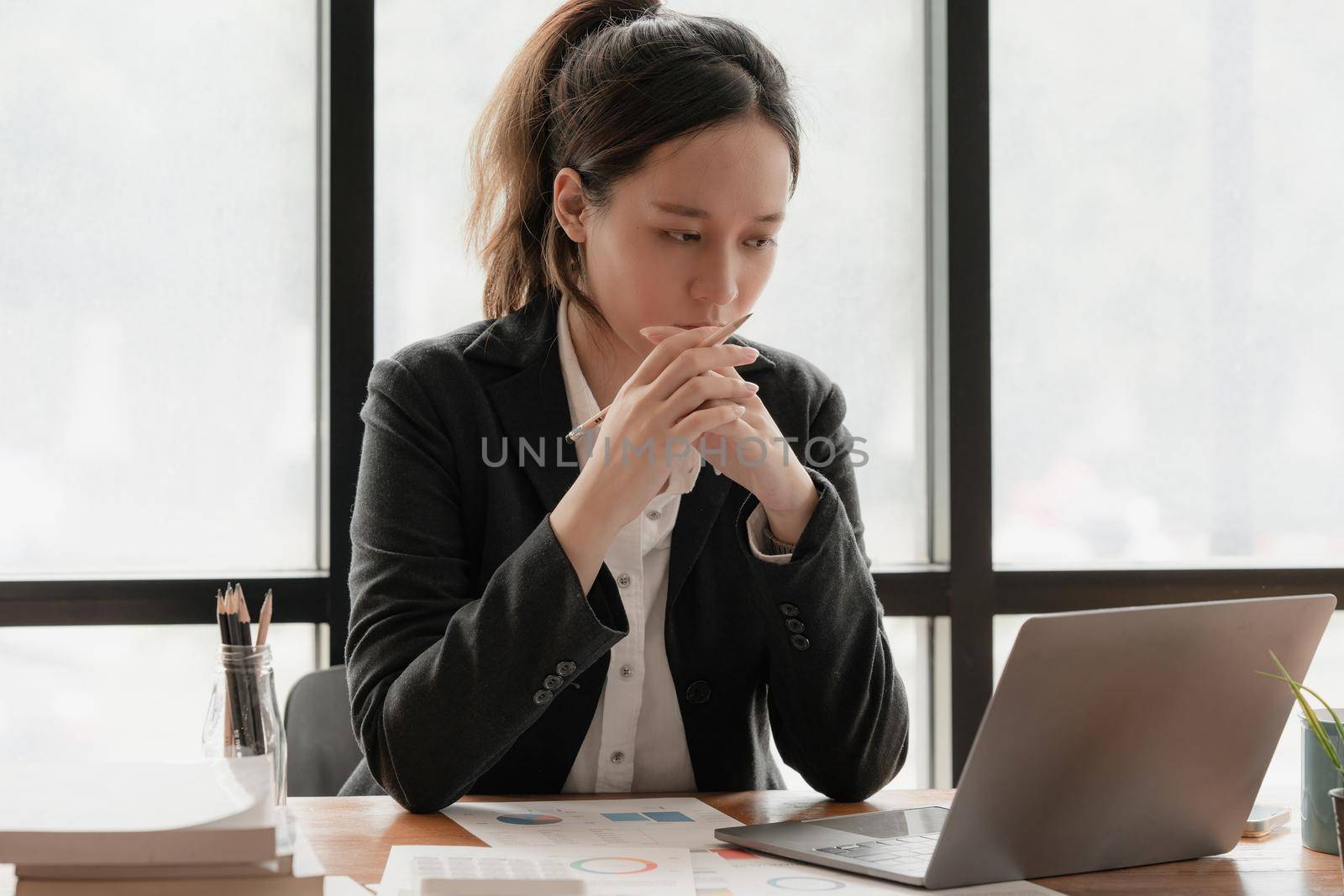 Image of Young woman working online on laptop computer. studying or working from home online concept