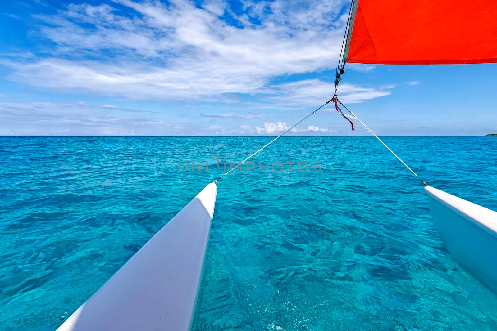 Beautiful seascape from the catamaran to Atlantic ocean and coastline, Turquoise water and blue sky with clouds. Cuba