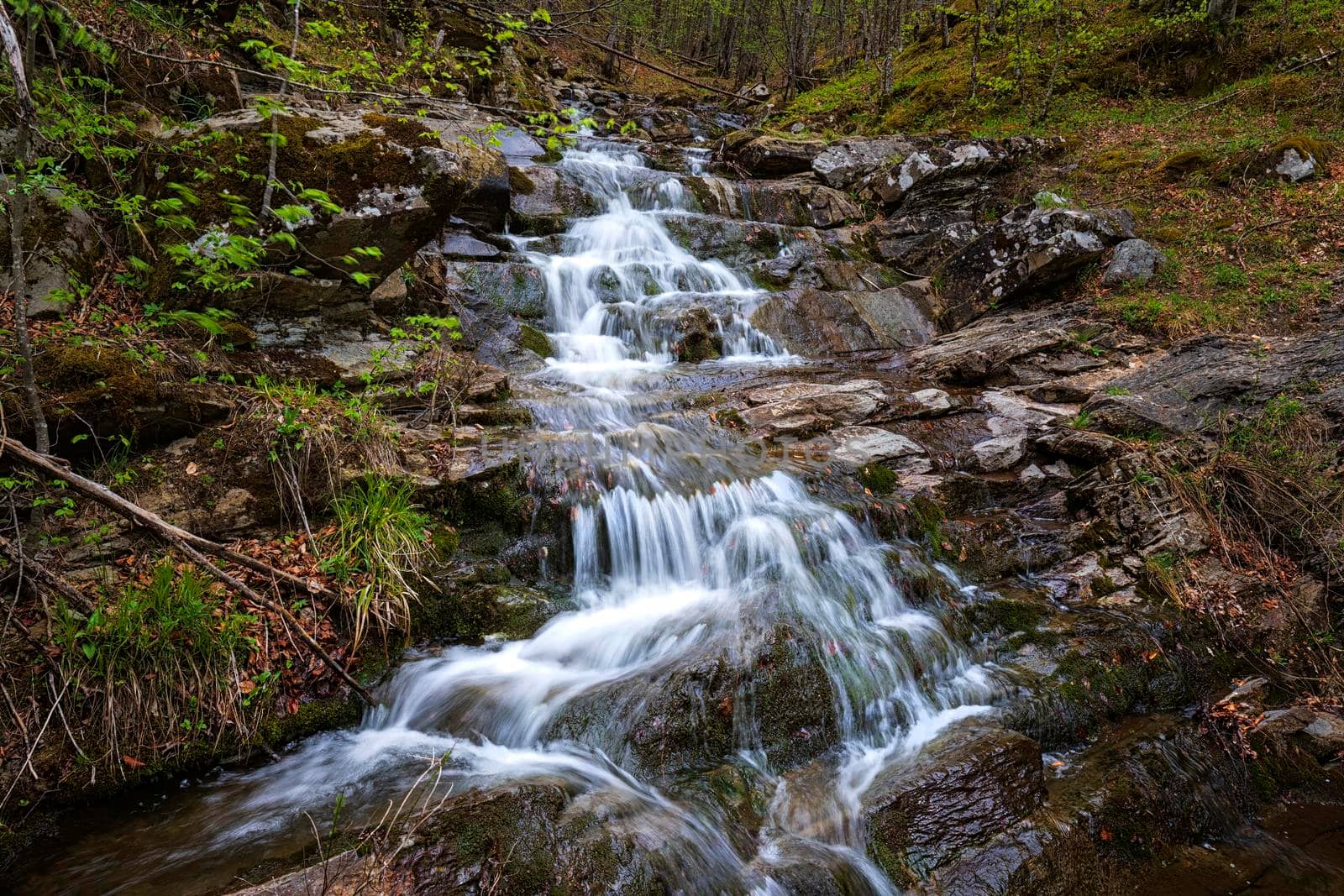 Beautiful autumn landscape of flowing cascade water in a mountain river