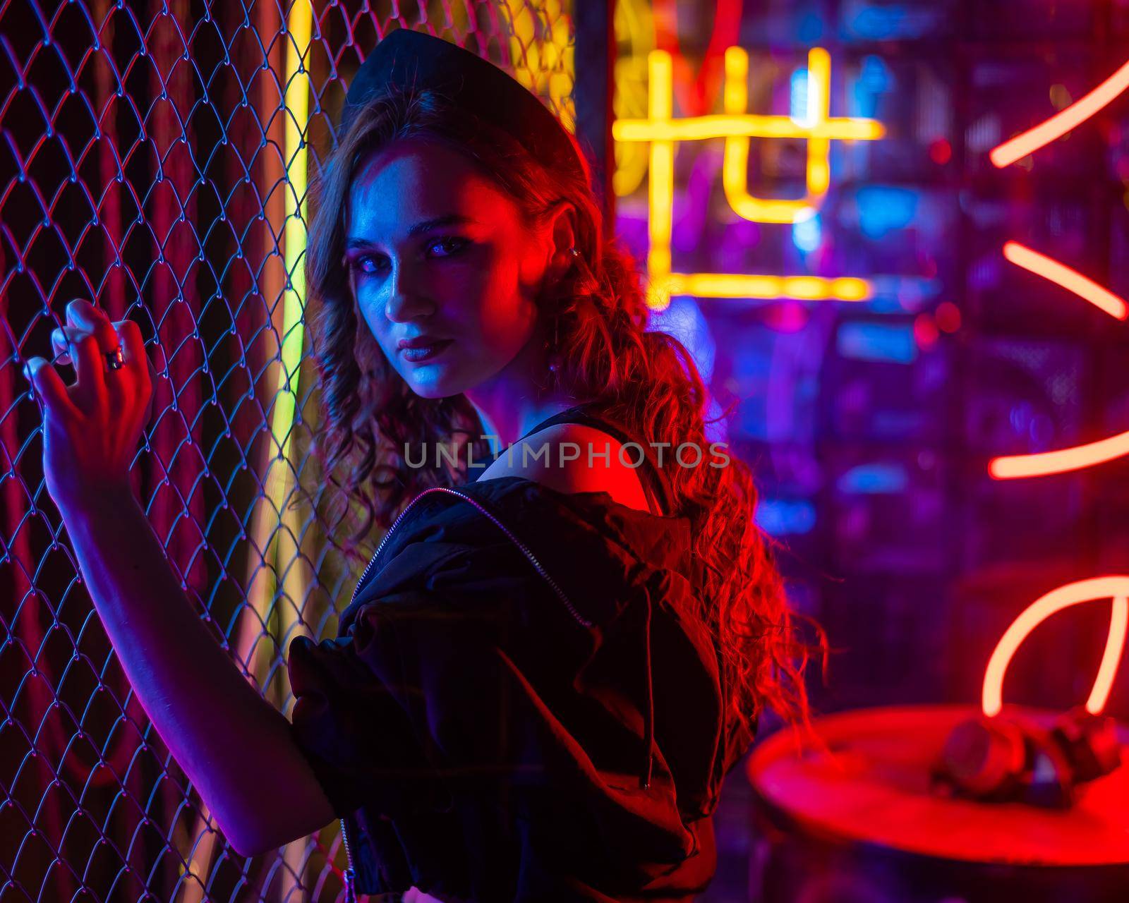 Caucasian woman posing in neon studio