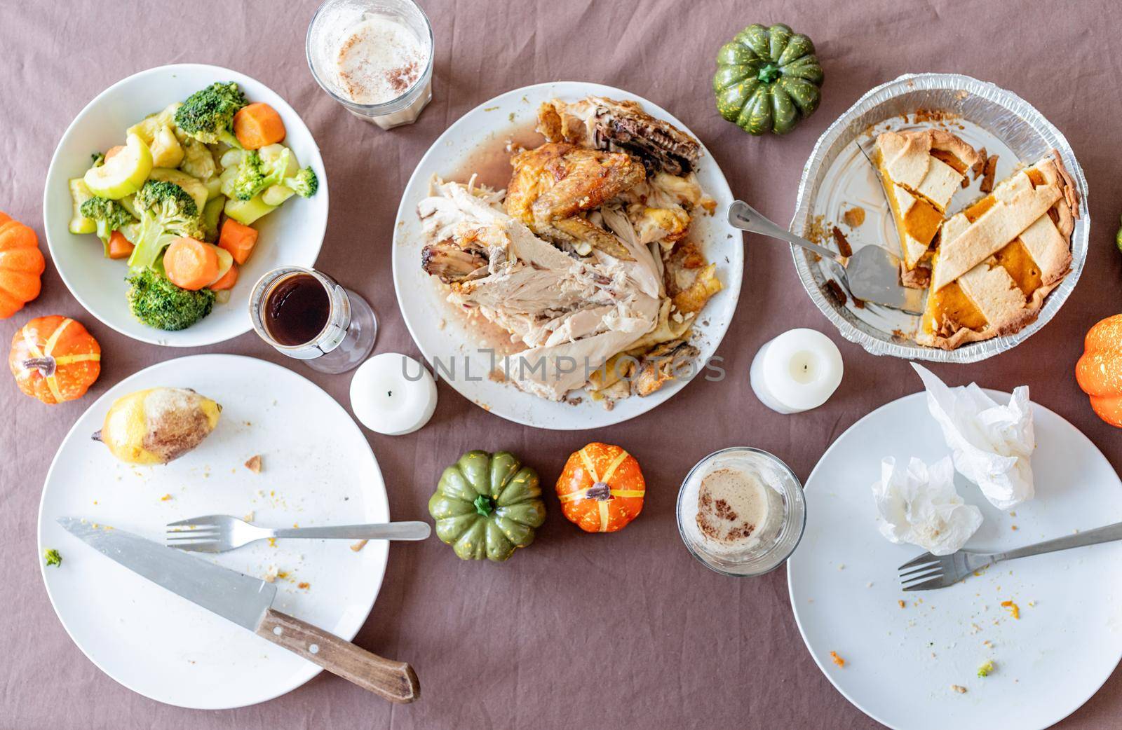 Happy Thanksgiving Day. Autumn feast. top view of thanksgiving table after feast, leftovers and dirty dishes. Cleaninf after feast