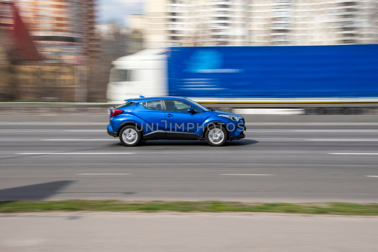 Ukraine, Kyiv - 6 April 2021: Blue Toyota C-HR car moving on the street. Editorial