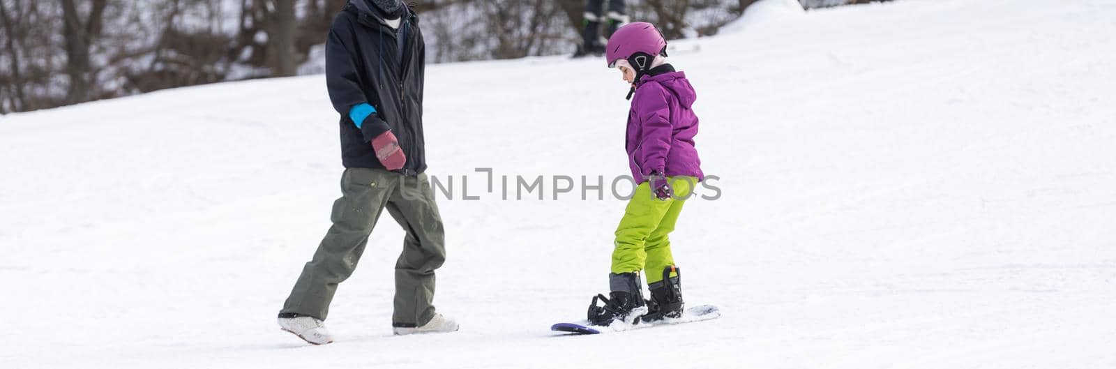 Ski Resort Father Teaching Little Daughter Snowboarding by Andelov13