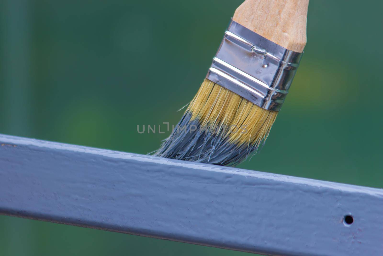 paint the iron frame with gray paint. selective focus