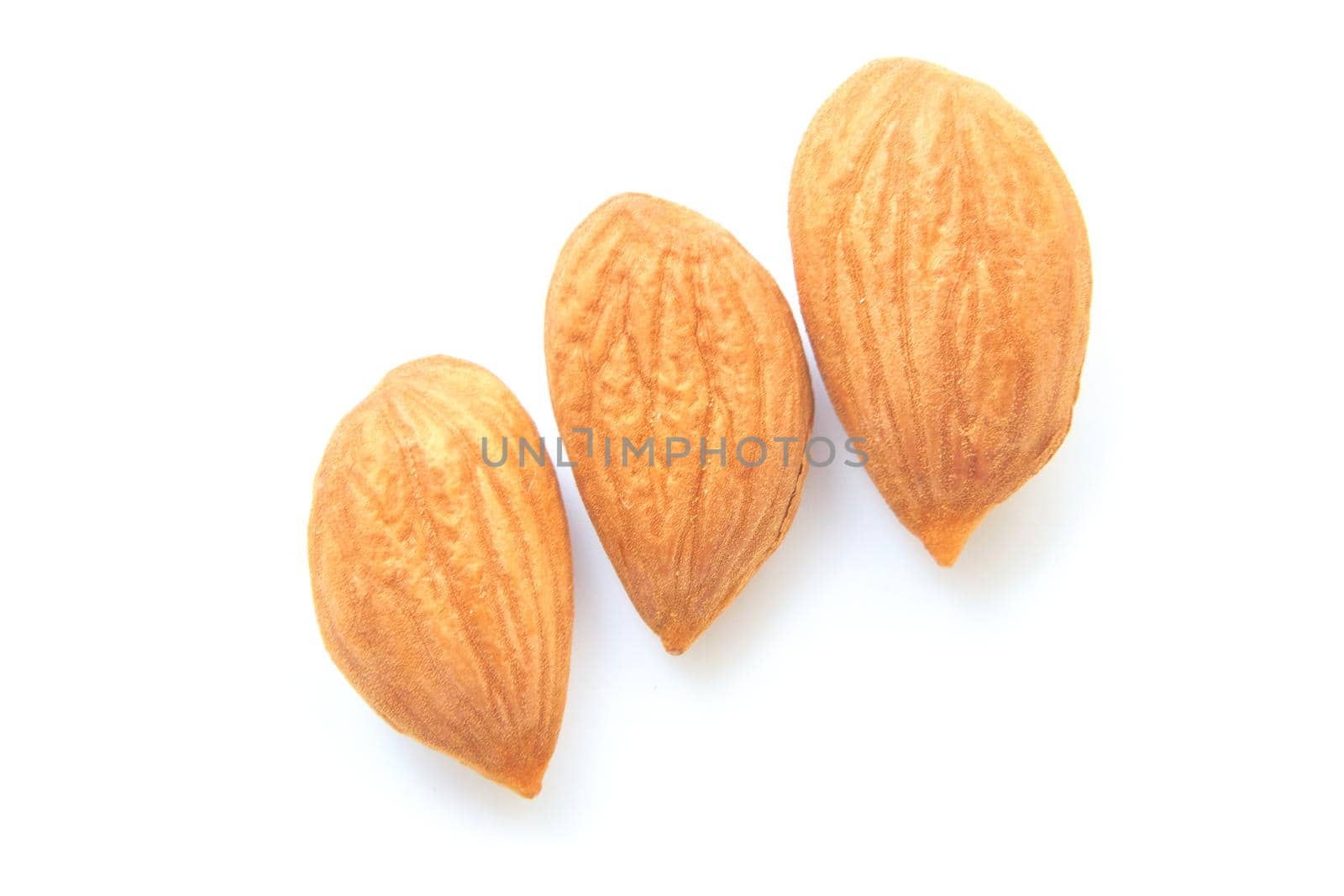 A softer, usually edible part of a nut, seed, or fruit stone contained within its hard shell. Ripe apricot kernels, taste of warm summer.